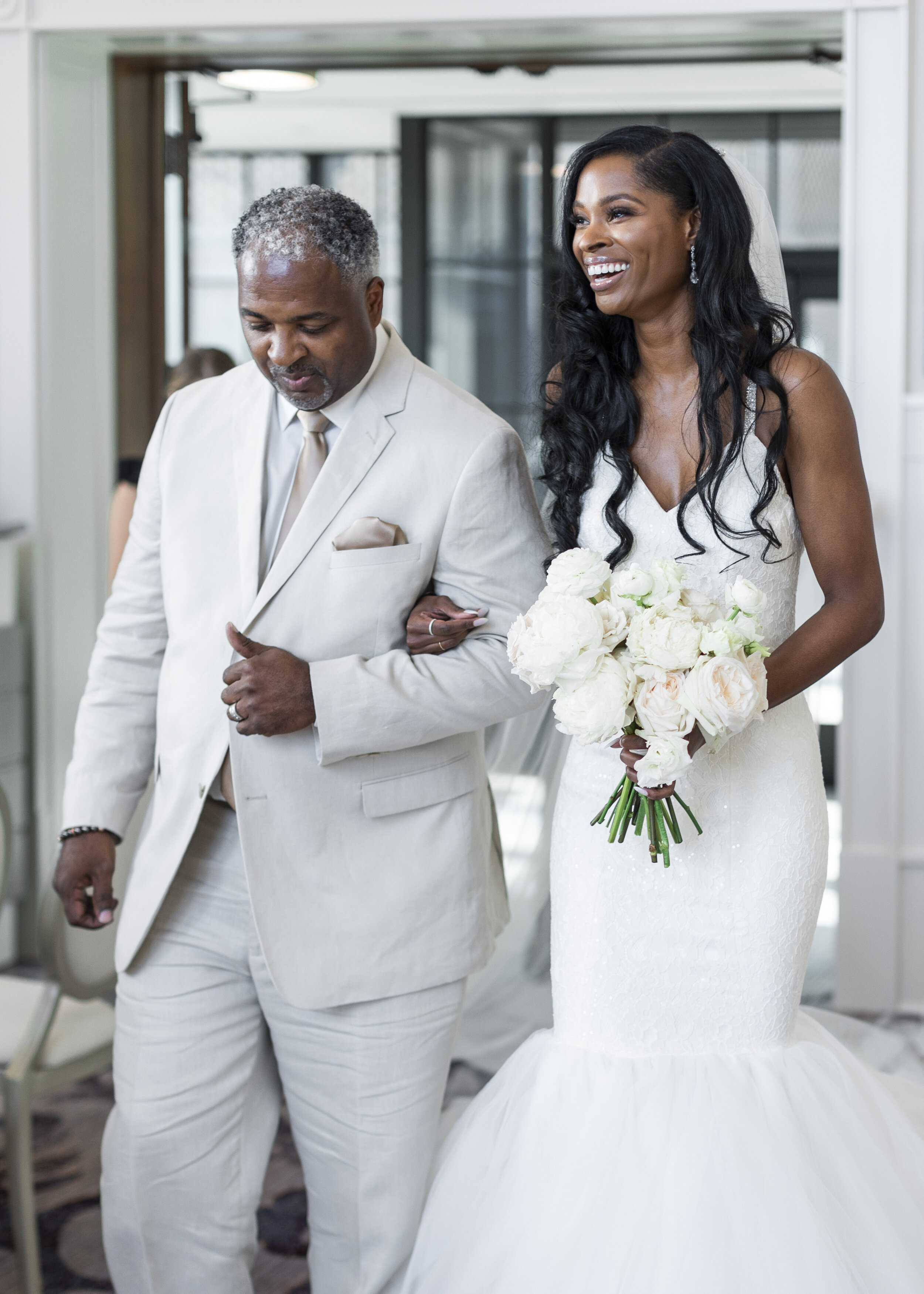  The smile says it all as a lovely bride and her father walk down the aisle during a Dallas wedding. Father of the bride outfit ideas bridal hair inspiration grapevine photographer traveling photographer dallas texas wedding venue wedding dress ideas