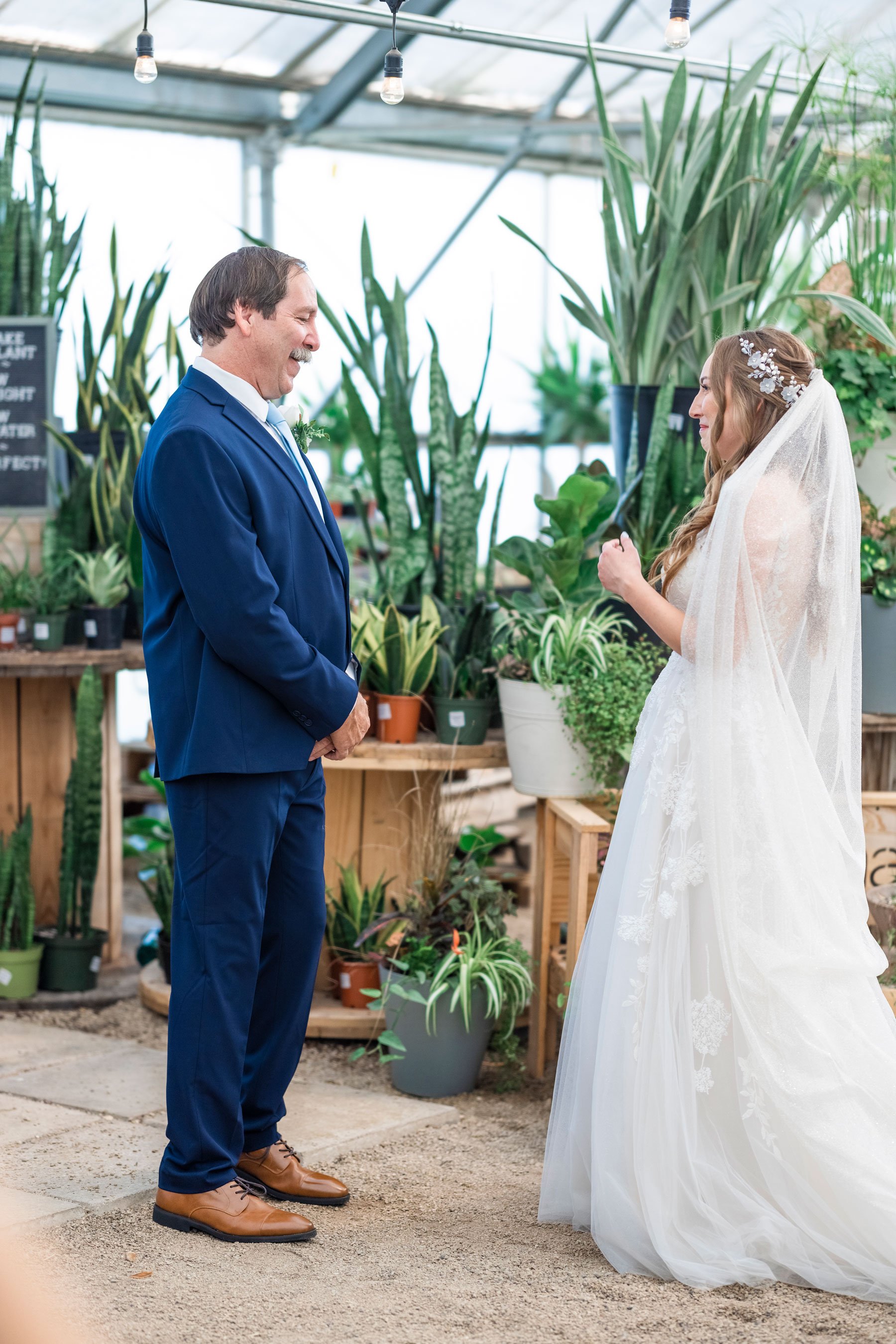  Savanna Richardson Photographer captures a dad’s first look at his beautiful daughter in her wedding gown with green plants all around them in Utah County. Utah County professional wedding photographer Orem weddings Orem wedding venues #savannaricha