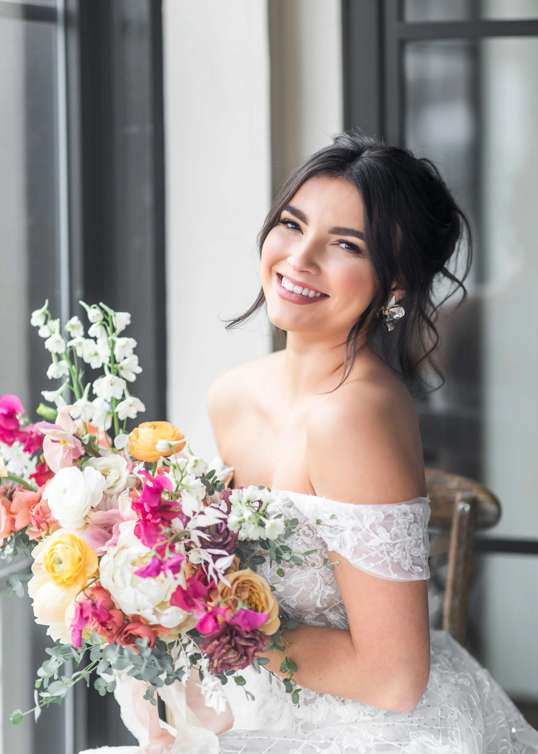  A bride holding a bright pink and yellow bouquet smile on her wedding day in Utah by Savanna Richardson Photography. bridal photography pink and yellow bouquet happy bride portrait northern Utah bridals Beautiful lighting for wedding #savannarichard