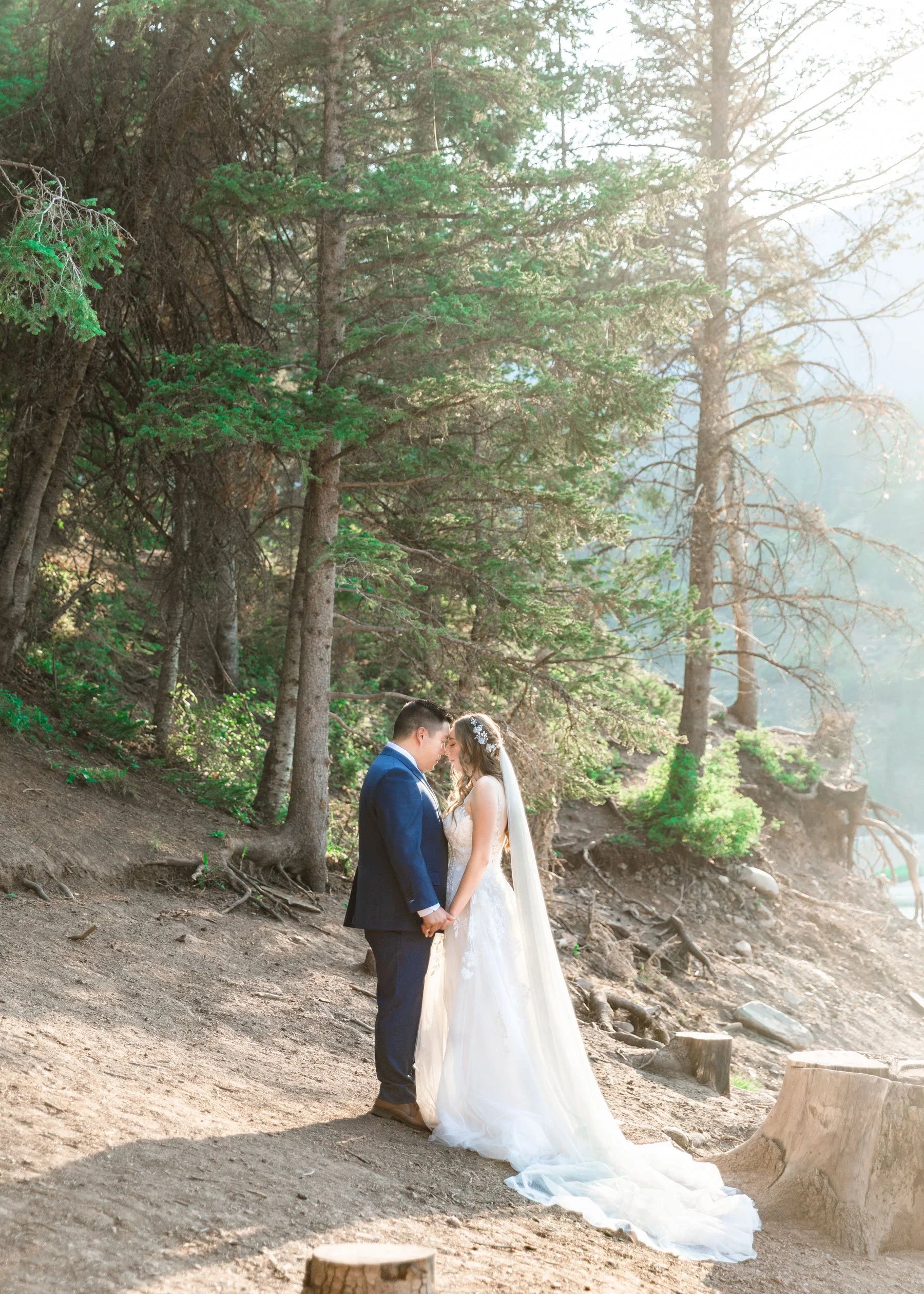  In the morning sunlight in the mountains, a couple takes their bridal portraits making it look natural by Savanna Richardson Photography in Utah. look your best in your wedding pics tips for looking best in pictures #savannarichardsonphotography #Sa