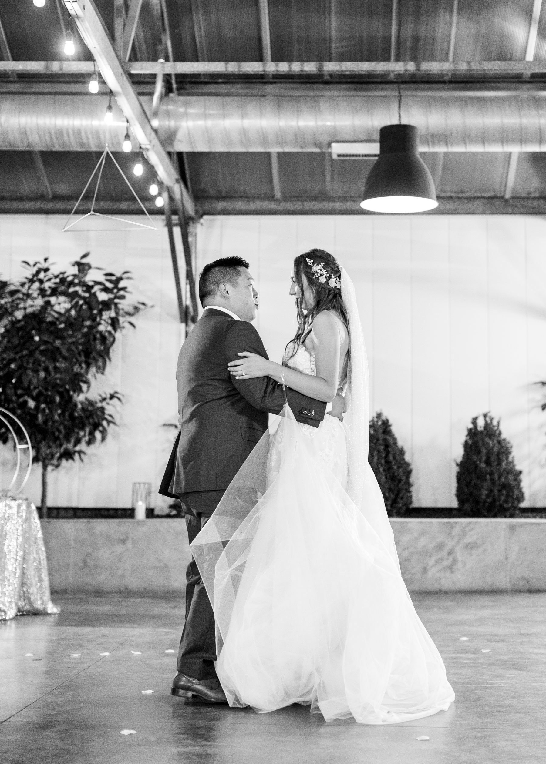  Professional Utah County wedding photographer Savanna Richardson Photography captures a bride and groom's first dance at Shade and Home Garden Center in Orem. first dance black and white wedding dance photos just married pictures #savannarichardsonp