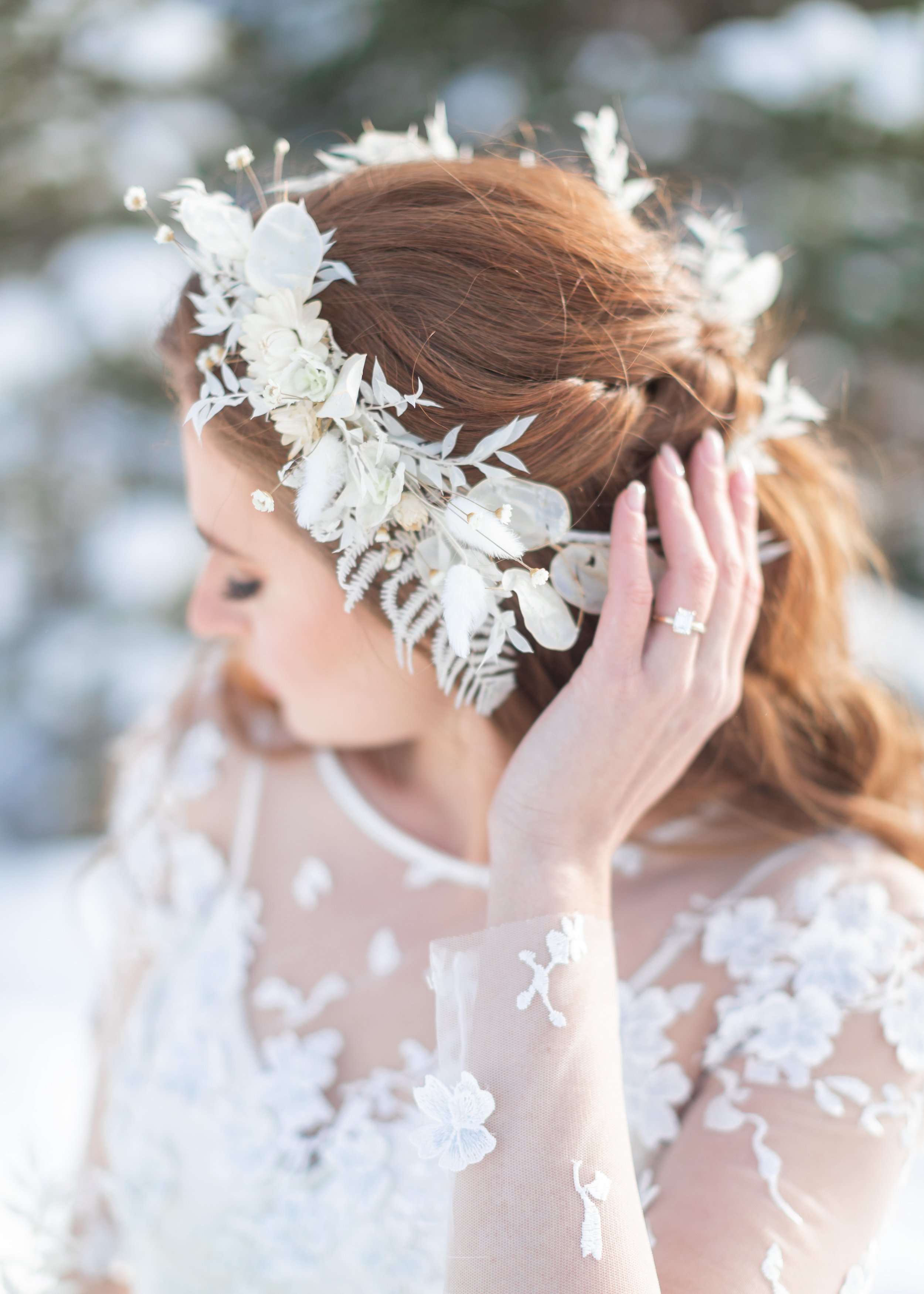  Savanna Richardson Photography captures a bride wearing a white floral wreath in her red hair. winter wedding bridal hair ideas floral headband #savannarichardsonphotography #utahvendor #utahweddingphotographer #MilleFleurDesign #Utahweddingdesigns 