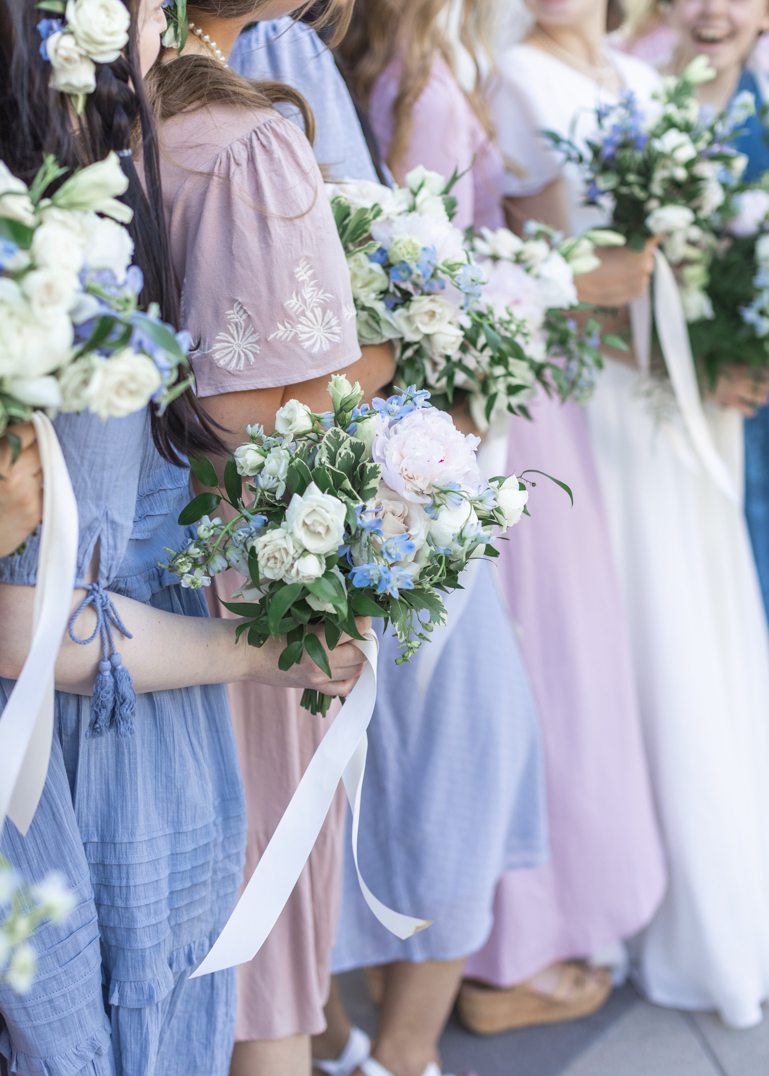  Bridesmaids holding their floral bouquets designed by Mille Fleur Design captured by Savanna Richardson Photography. bridesmaid bouquet #savannarichardsonphotography #utahvendor #utahweddingphotographer #MilleFleurDesign #Utahweddingdesigns 
