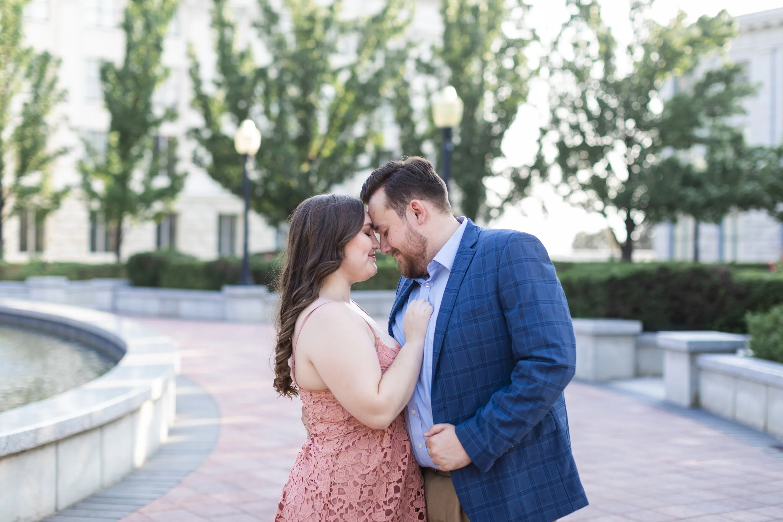  Head to head a newly engaged couple snuggle in front of the Utah State Capitol building. by Savanna Richardson Photography. engagements in UT #savannarichardsonphotography #Utahcapitolphotography #utahengagements #utahengagementphotographer 