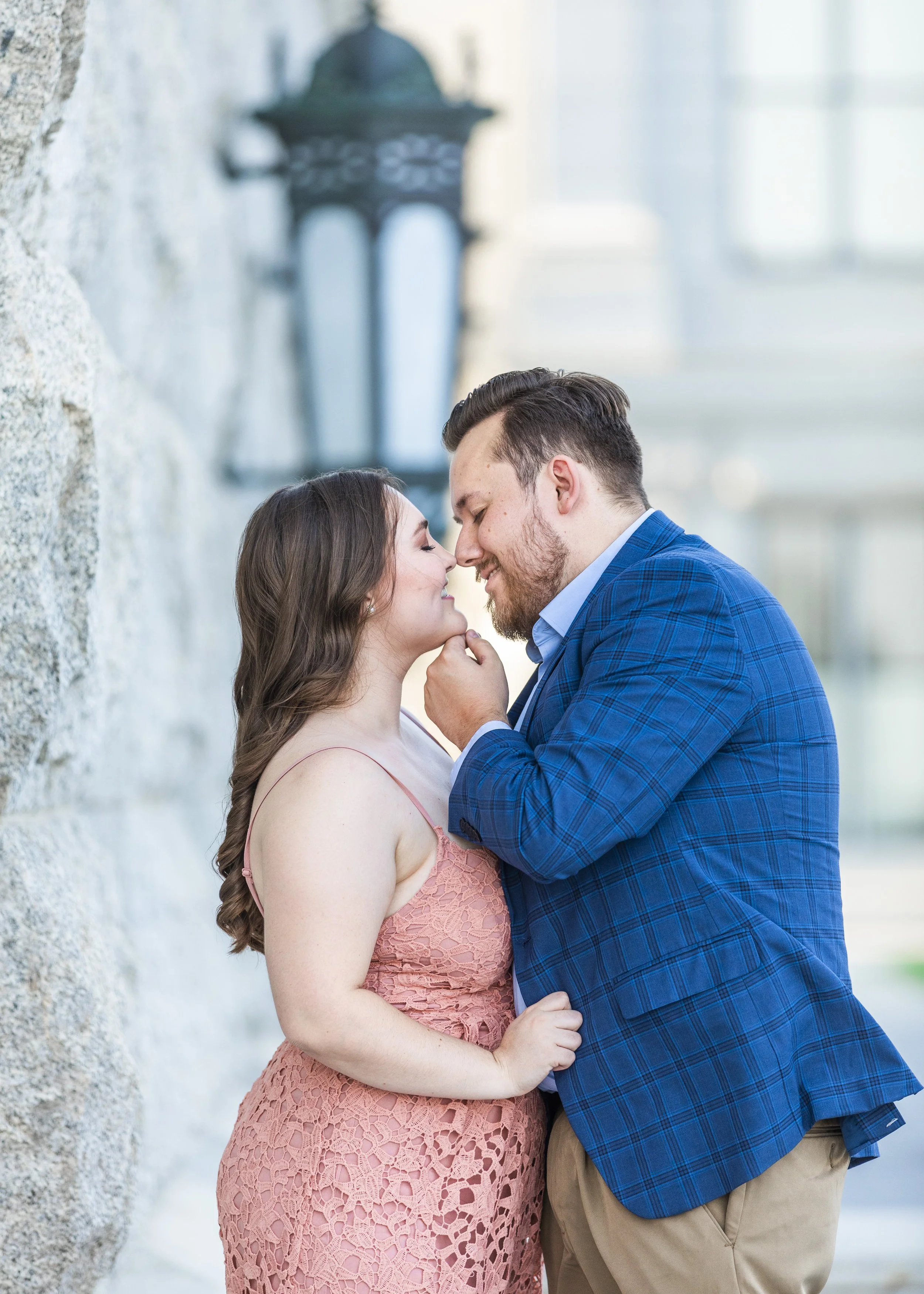  Savanna Richardson Photography captures a newly engaged couple kissing in SLC, Utah. engagement locations in Utah professional wedding photographer #savannarichardsonphotography #Utahcapitolphotography #utahengagements #utahengagementphotographer 