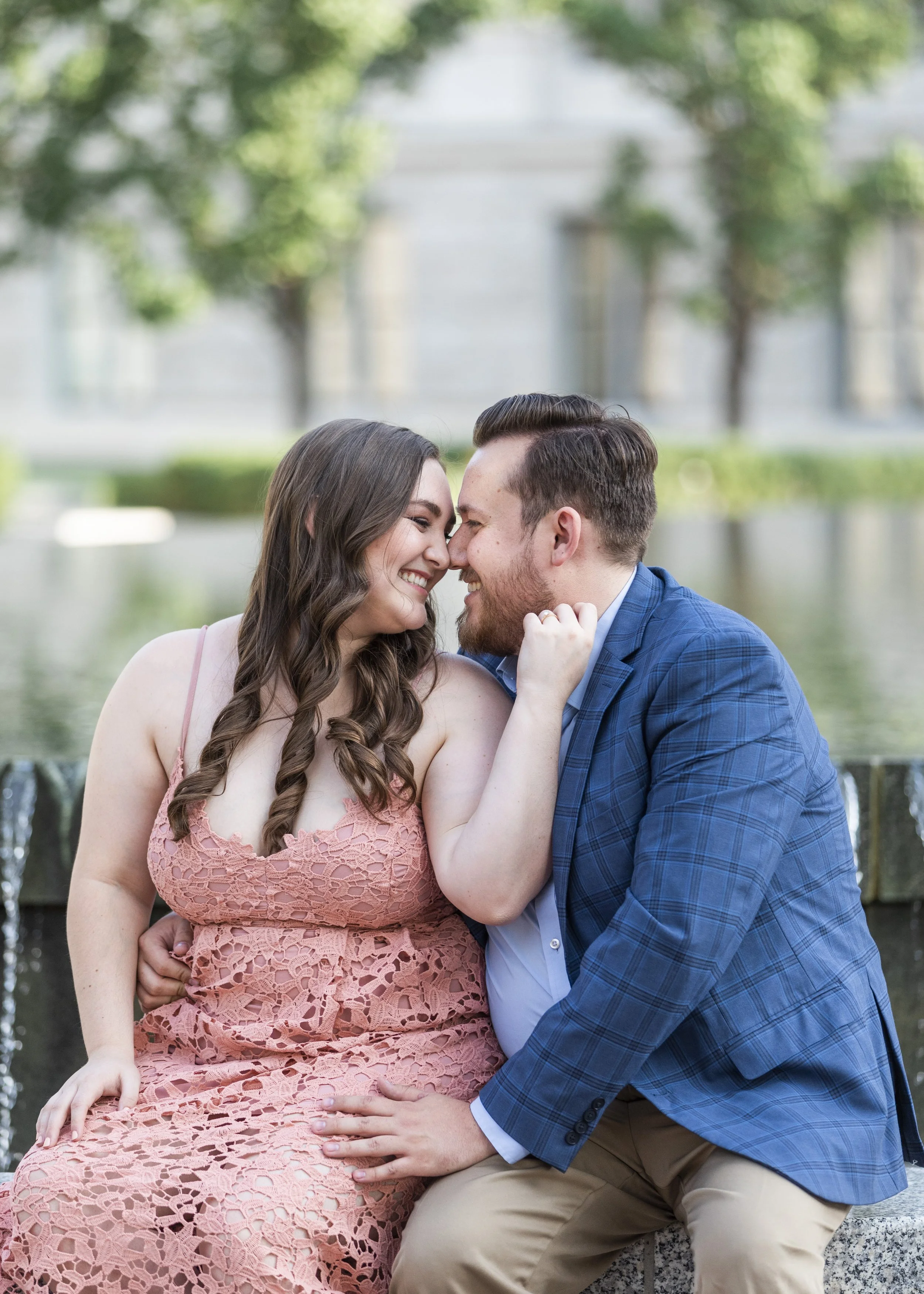  Savanna Richardson Photography SLC engagement photographer takes a couple of kissing portraits. kissing portrait Utah Summer photography navy suitcoat #savannarichardsonphotography #Utahcapitolphotography #utahengagements #utahengagementphotographer