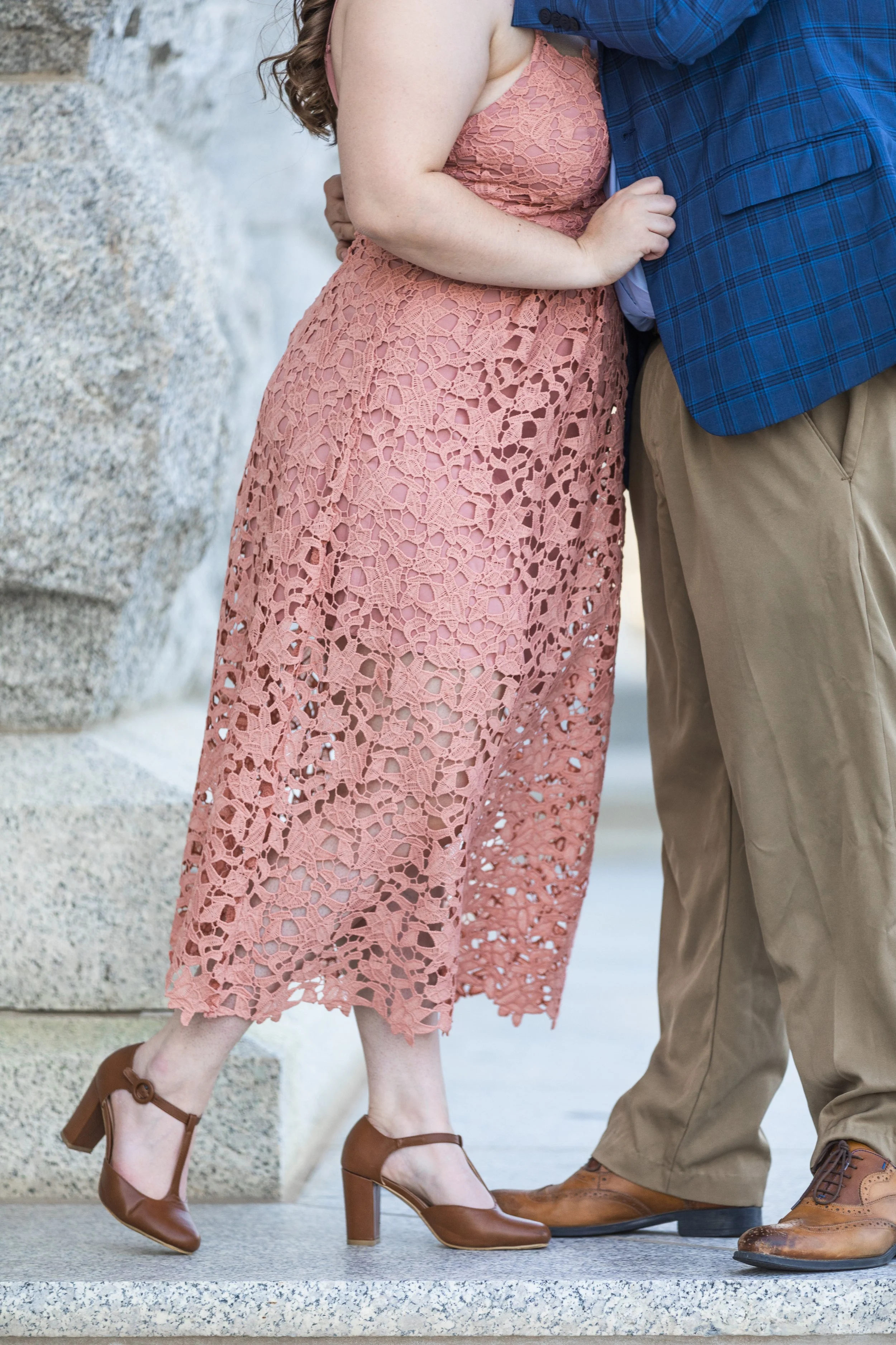  Savanna Richardson Photography captures a detailed photo of an engaged couple kissing in SLC. eyelet dress leather shoes Utah engagements #savannarichardsonphotography #Utahcapitolphotography #utahengagements #utahengagementphotographer 