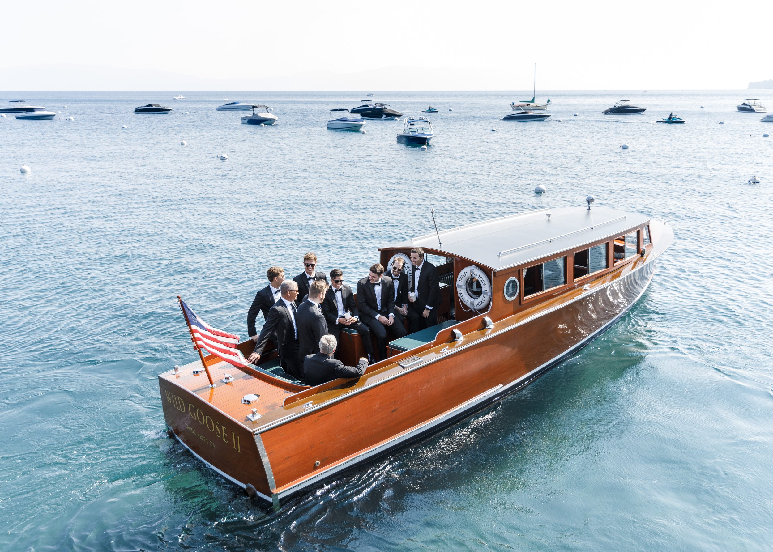  Groomsmen Party on a boat on the blue waters of Lake Tahoe by Savanna Richardson Photography. bachelor party groomsmen on boat Tahoe wedding idea #savannarichardsonphotography #tahoewedding #lakesidewedding #outdoorwedding #summerwedding #laketahoe 