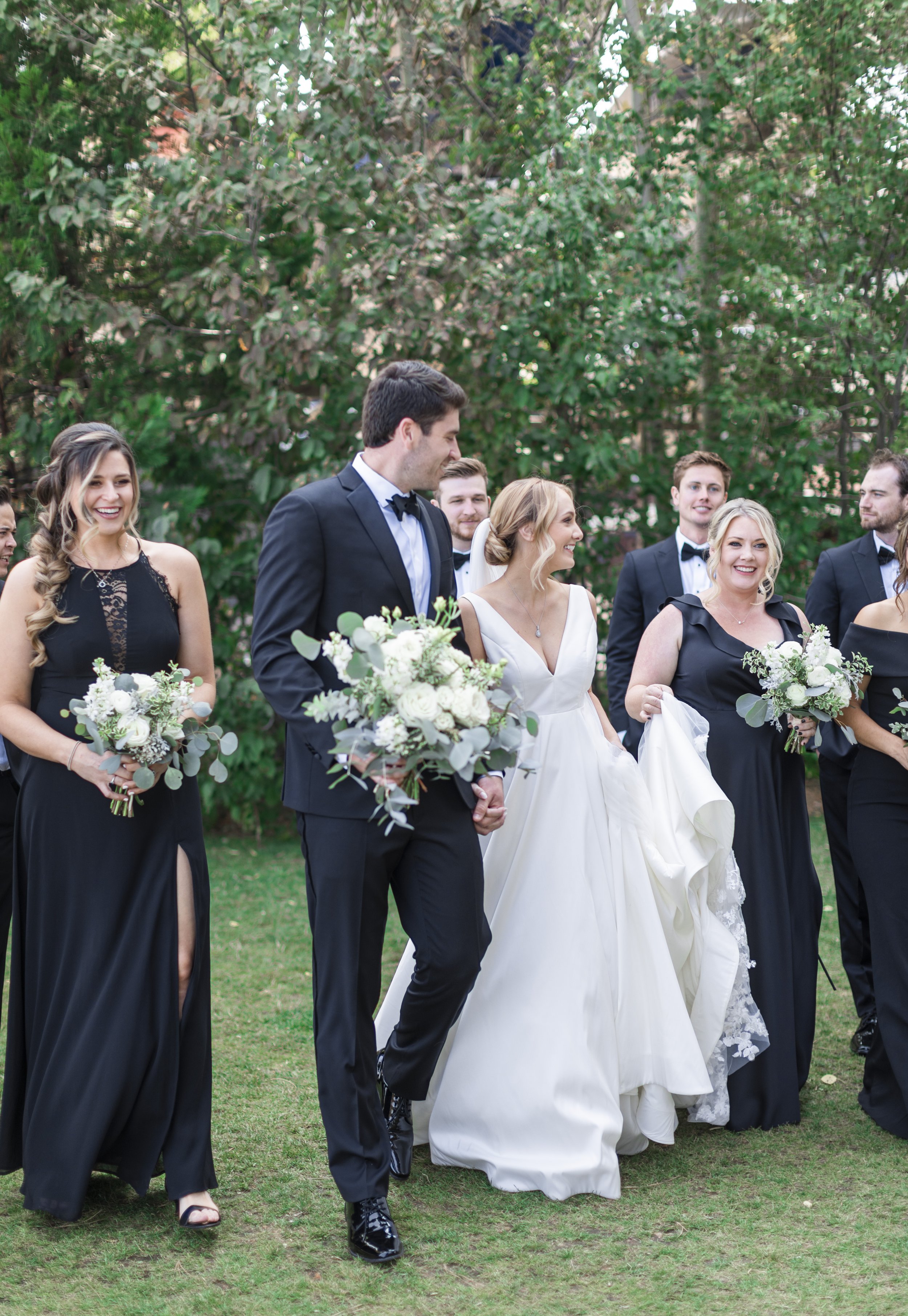  A bridal party all wearing black during an outdoor wedding captured by Savanna Richardson Photography. bridal party in black v-neck wedding gown #savannarichardsonphotography #tahoewedding #lakesidewedding #outdoorwedding #summerwedding #laketahoe 