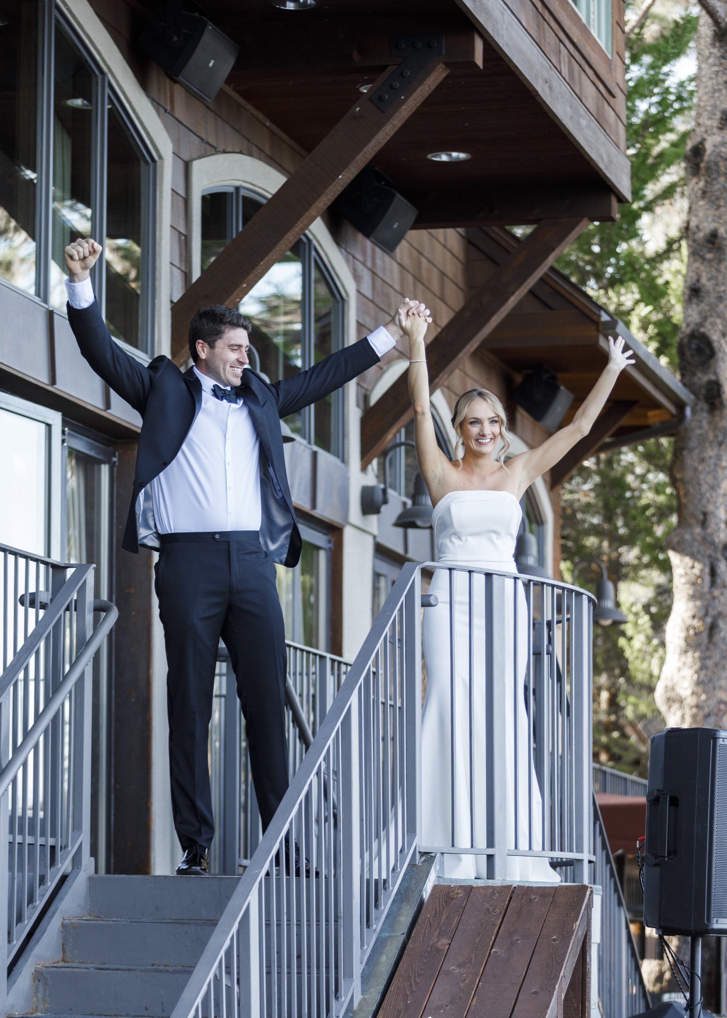  Savanna Richardson Photography captures a bride and groom cheering after their wedding ceremony at Lake Tahoe. Lake wedding ideas newly married #savannarichardsonphotography #tahoewedding #lakesidewedding #outdoorwedding #summerwedding #laketahoe 