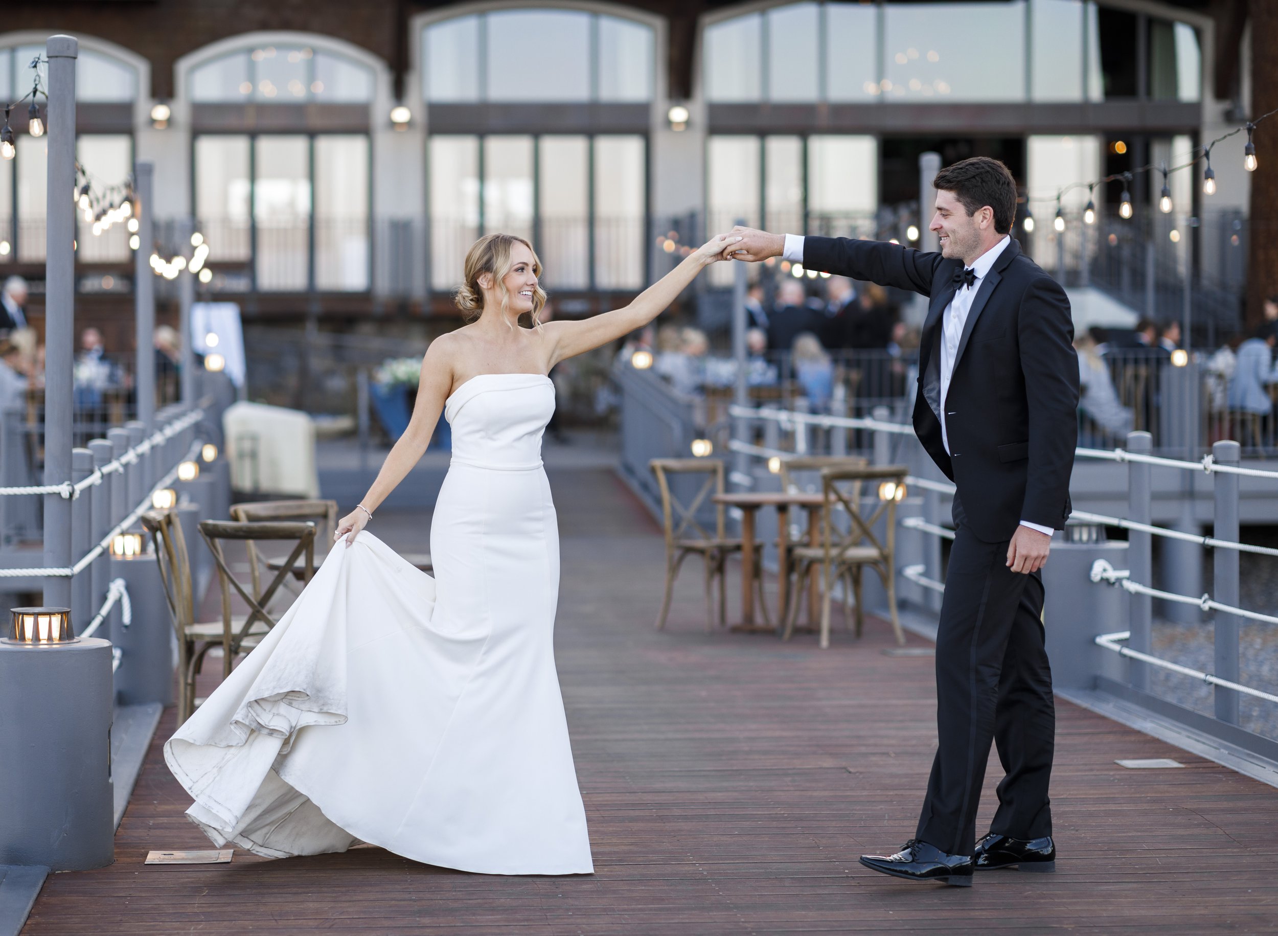  A bride and groom dance on a lake pier during a summer wedding captured by Savanna Richardson Photography. newlyweds dancing on a pier #savannarichardsonphotography #tahoewedding #lakesidewedding #outdoorwedding #summerwedding #laketahoe 