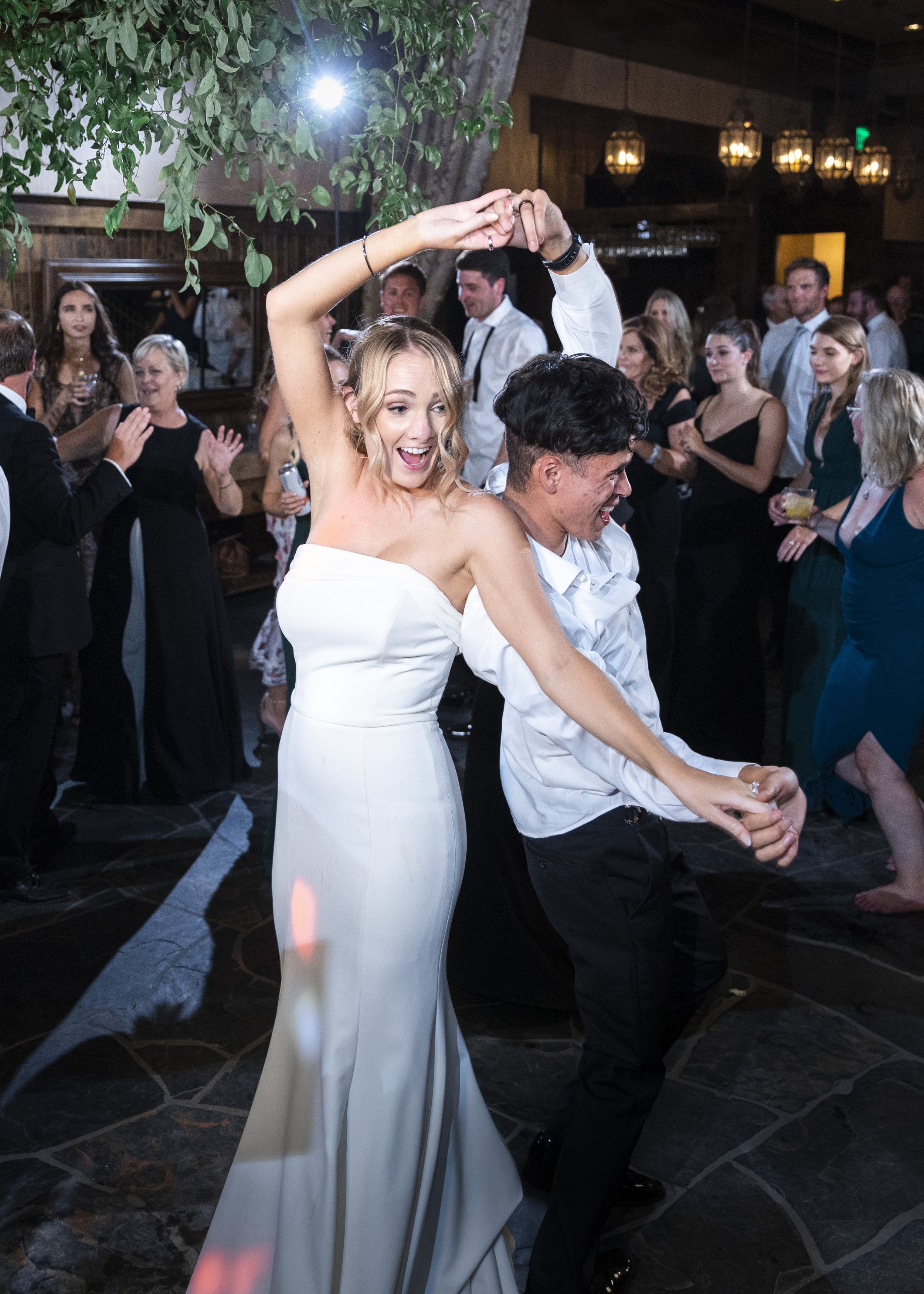  Savanna Richardson Photography captures the bride dancing with the groomsmen in the moonlight. dancing after the wedding outdoor wedding dancing #savannarichardsonphotography #tahoewedding #lakesidewedding #outdoorwedding #summerwedding #laketahoe 