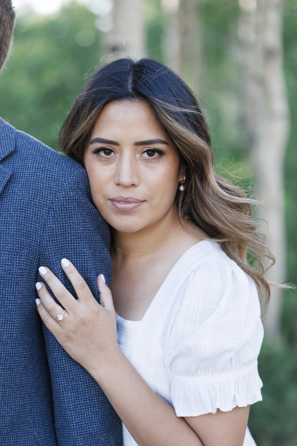  A woman with her hand on her fiance's arm showing off her wedding ring was captured by Savanna Richardson Photography. ritzy photographer in Utah #ParkCityEngagements #ParkCityPhotographers #SavannaRichardsonPhotography #SavannaRichardsonEngagements