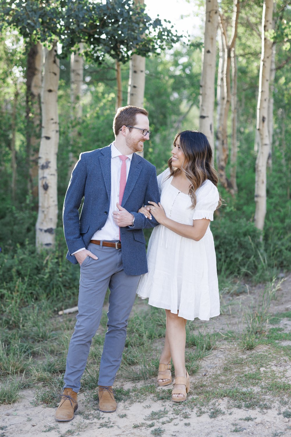  High-end Park City wedding photographer captures a couple in the mountains looking at one another by Savanna Richardson Photography. summer #ParkCityEngagements #ParkCityPhotographers #SavannaRichardsonPhotography #SavannaRichardsonEngagements 