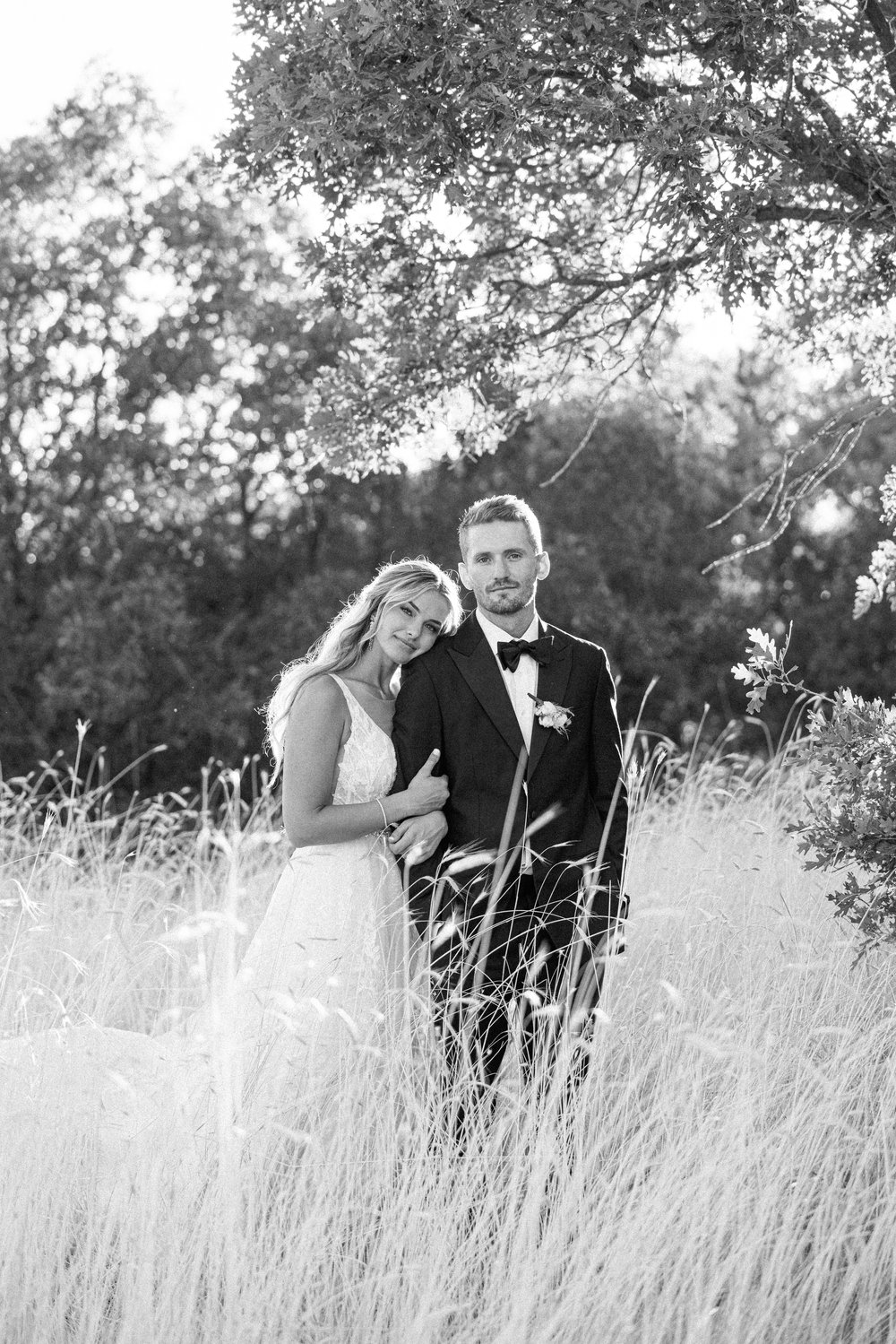  A bride and groom stand at dusk among tall grass for their wedding day by Savanna Richardson Photography. Utah photographers professional #SavannaRichardsonPhotography #SavannaRichardsonWeddings #QuietMeadowFarms #MapletonUTweddingphotographers 