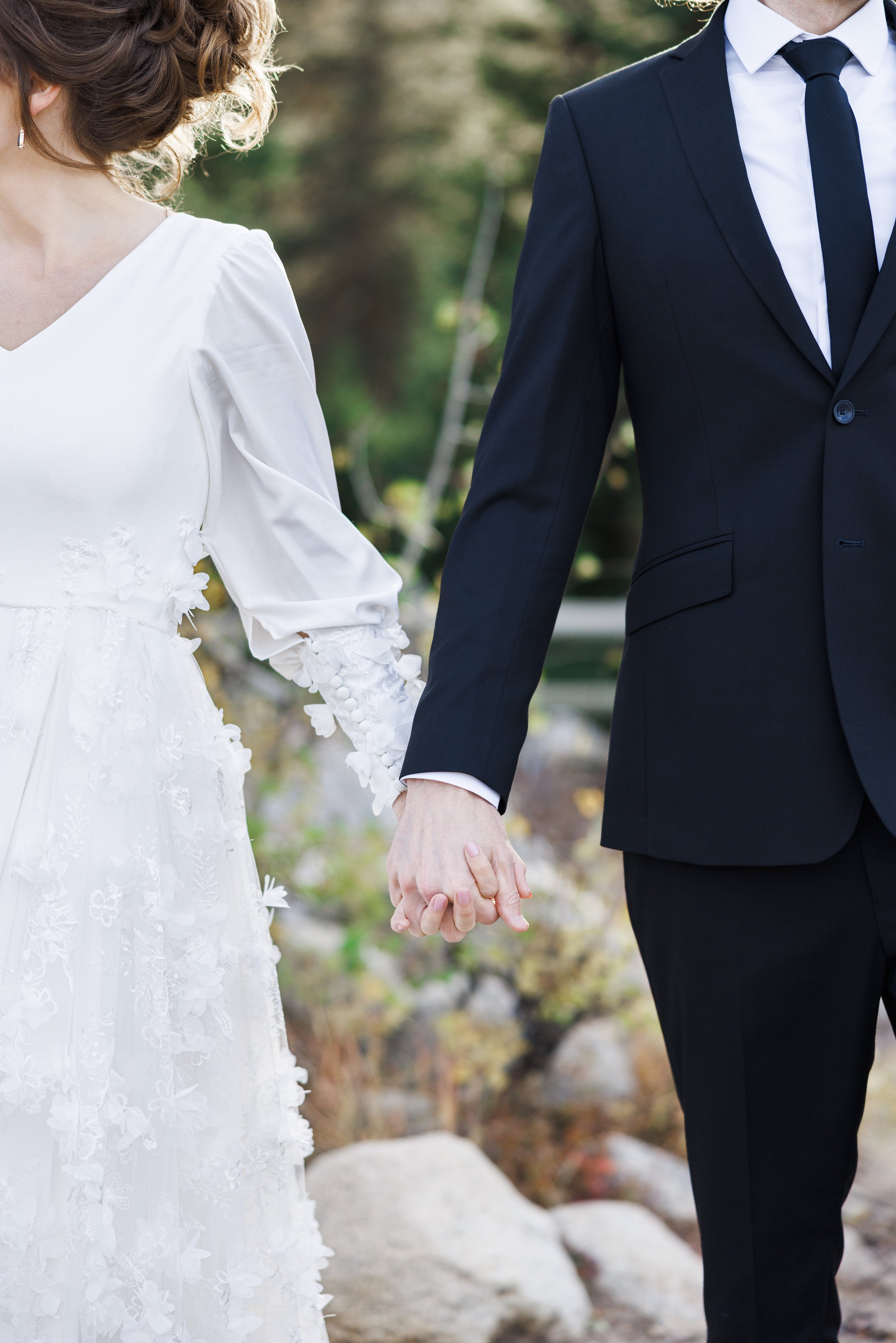  Professional Wedding photographer Savanna Richardson Photography captures a modern wedding portrait of the bride and groom holding hands. #SavannaRichardsonPhotography #SavannaRichardsonFormals #CottonwoodCanyon #WeddingFormals #SLCWedding #fallwed 