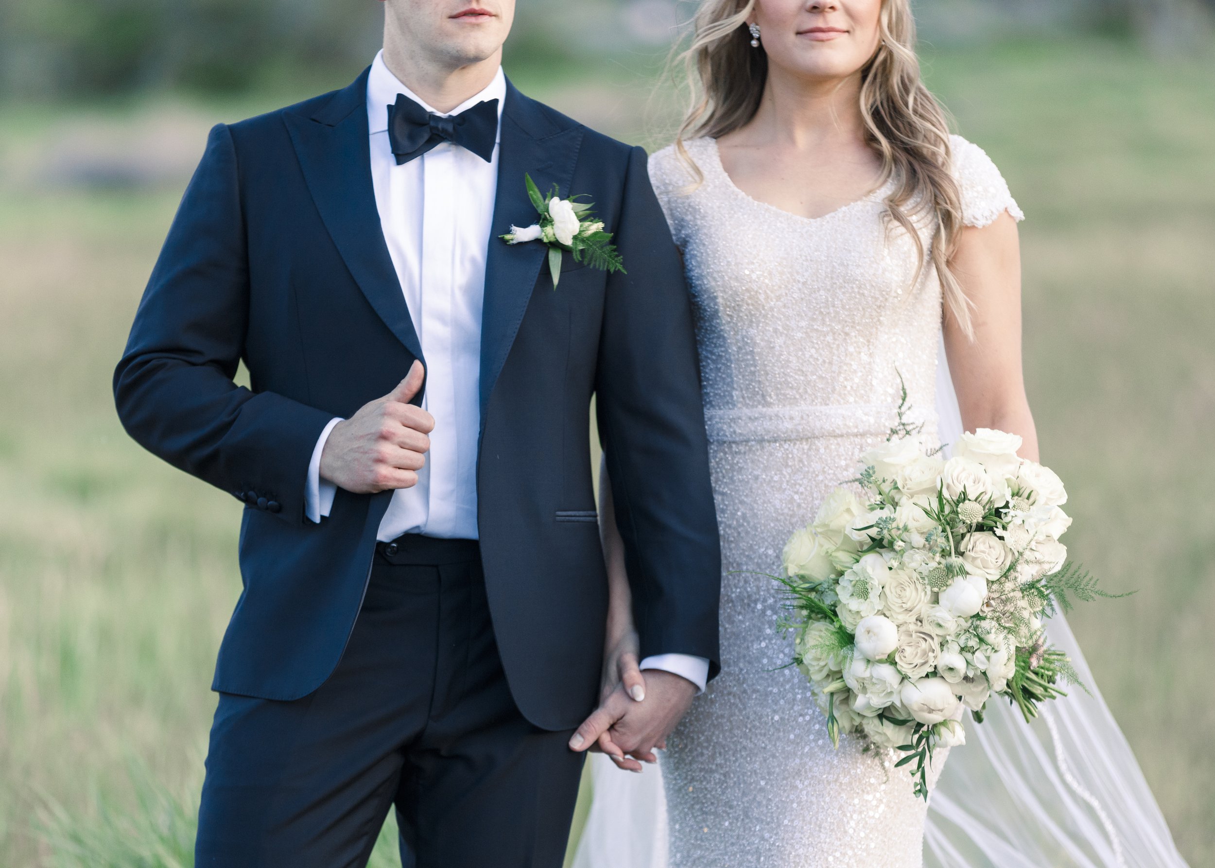  Detailed wedding portrait of the bride and groom holding hands by Savanna Richardson Photography. black suit holding hands #SavannaRichardsonPhotography #SavannaRichardsonWeddings #bridals #formals #bouquets #Utahweddingphotographers #Wedding 