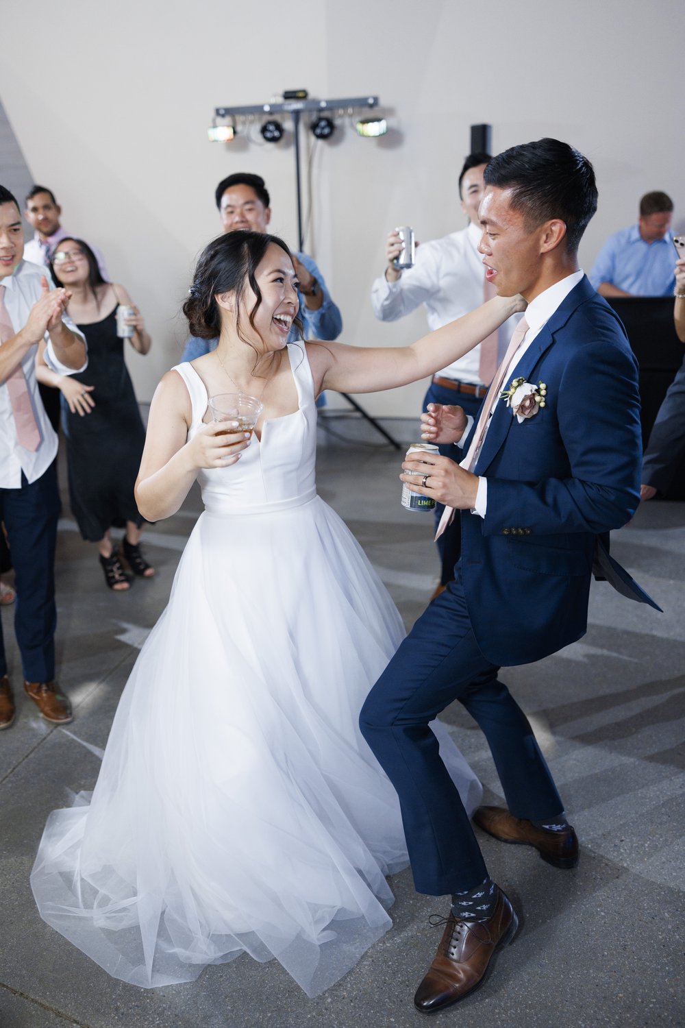  A bride and groom dance at their reception with drinks in their hands by Savanna Richardson Photography. reception photographer UT #SavannaRichardsonPhotography #SavannaRichardsonWeddings #bridals #formals #bouquets #Utahweddingphotographers #Weddin