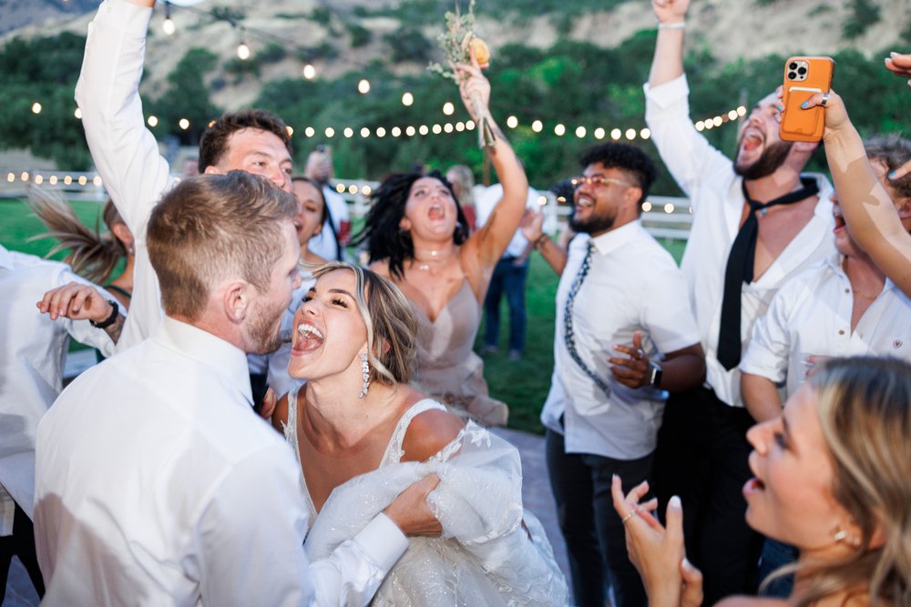  Savanna Richardson Photography captures the bride laughing while dancing at her outdoor reception. outdoor reception ideas #SavannaRichardsonPhotography #SavannaRichardsonWeddings #bridals #formals #bouquets #Utahweddingphotographers #Wedding 