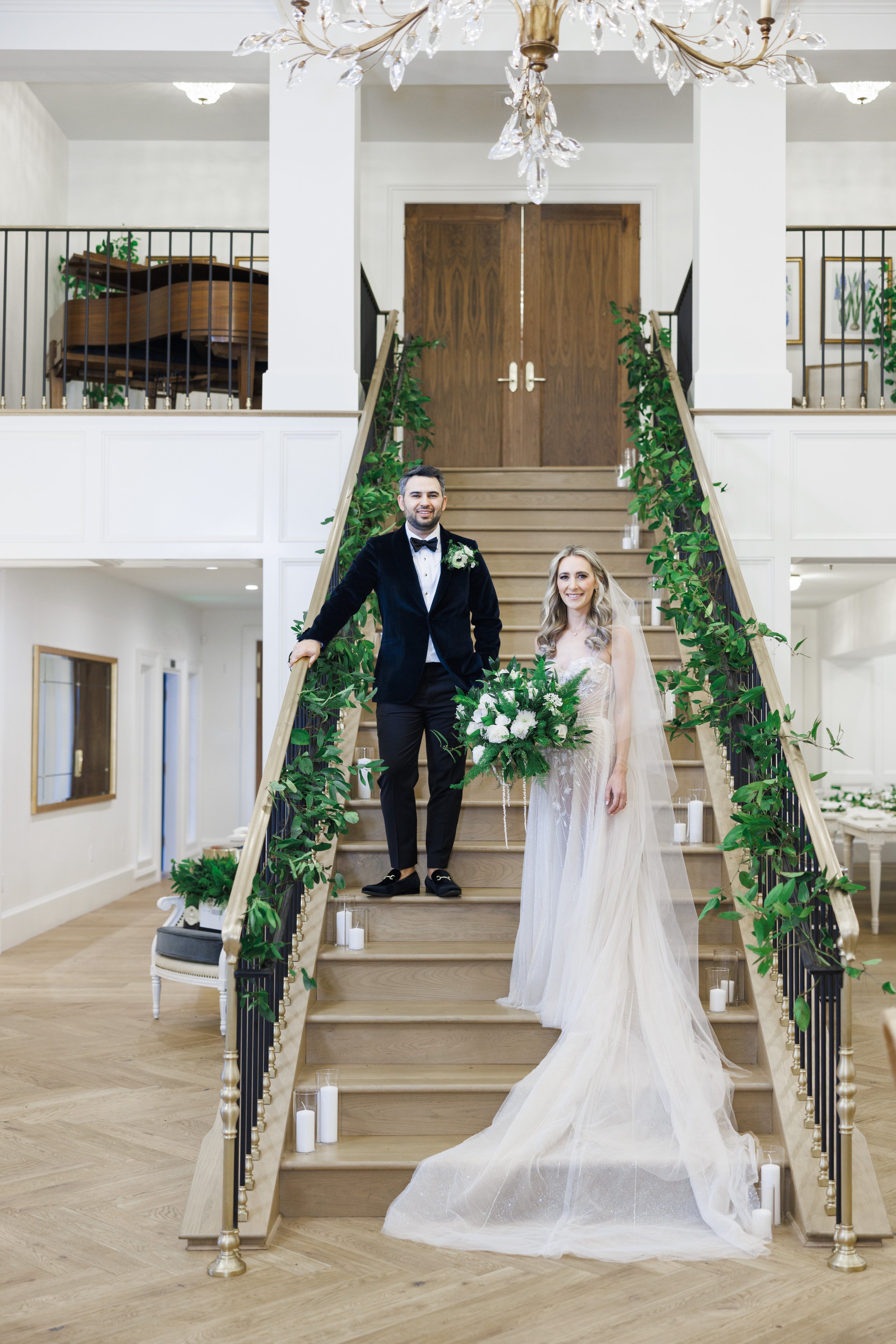  High-end wedding photographer captures a portrait of the newlyweds on event stairs by Savanna Richardson Photography. married #SavannaRichardsonPhotography #SavannaRichardsonWeddings #NYEwedding #magicalwedding #snowywedding #holidaywedding #married