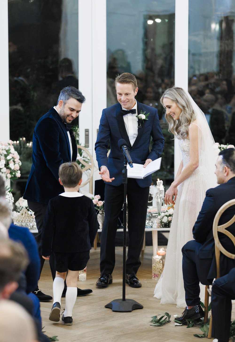  A little ring bearer presents the wedding rings to the couple captured by Savanna Richardson Photography. wedding rings #SavannaRichardsonPhotography #SavannaRichardsonWeddings #NYEwedding #magicalwedding #snowywedding #holidaywedding #married 