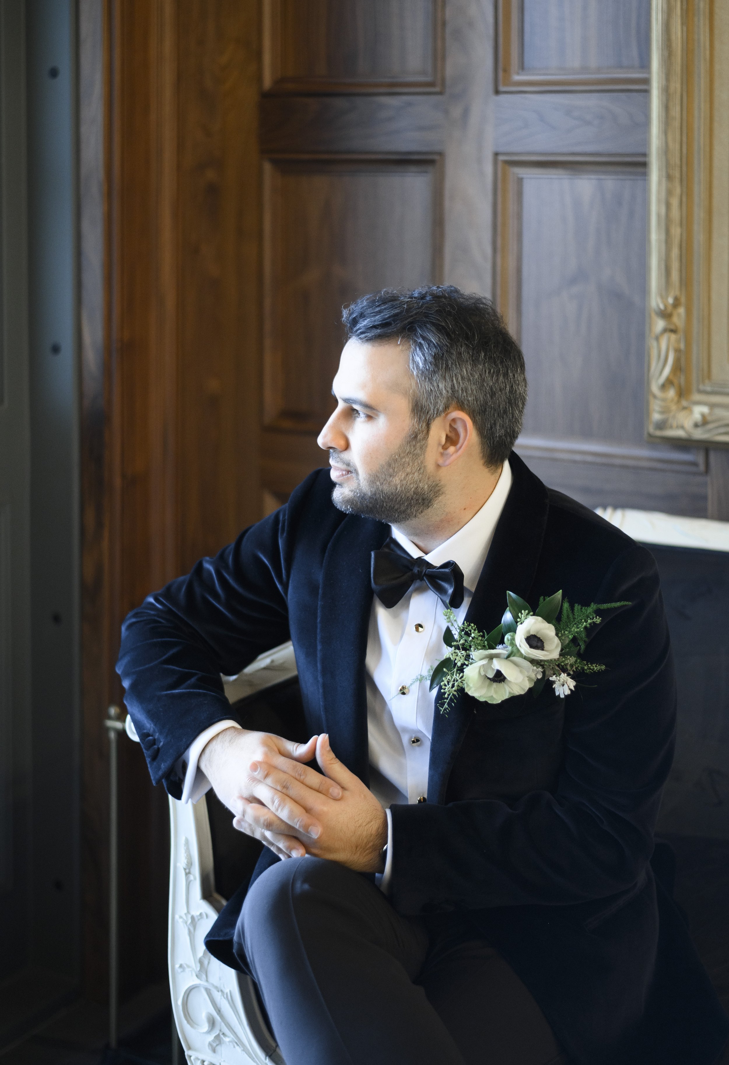  A groom portrait captured with him in deep thought on his wedding day by Savanna Richardson Photography. black suit bowtie #SavannaRichardsonPhotography #SavannaRichardsonWeddings #NYEwedding #magicalwedding #snowywedding #holidaywedding #married 