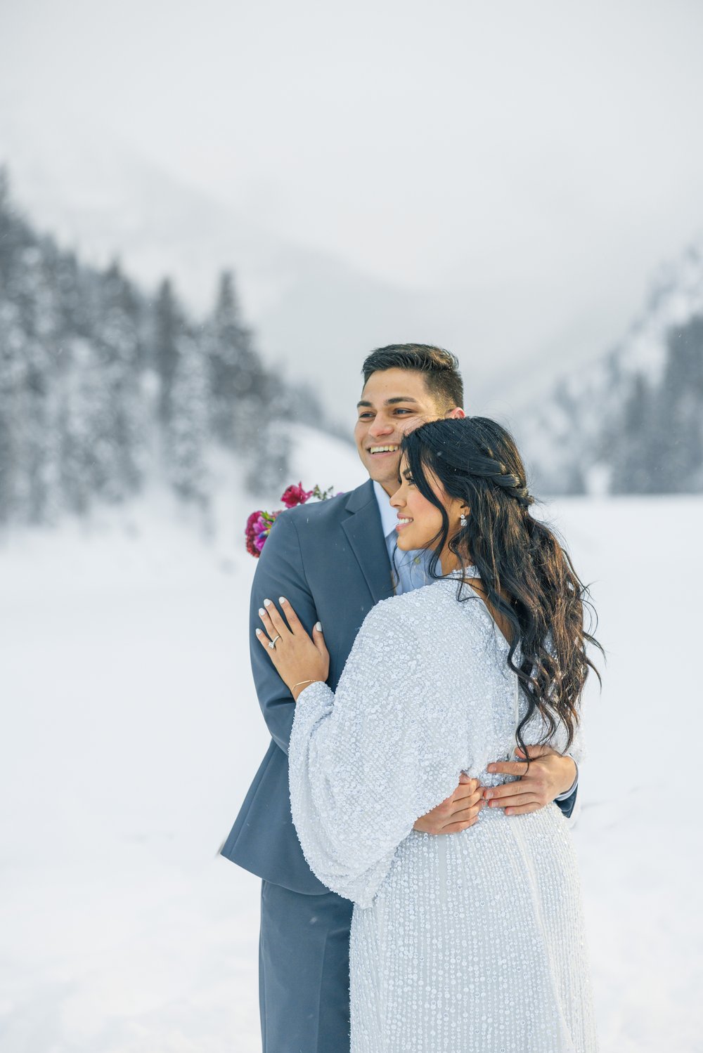  Professional bridal photographer Savanna Richardson Photography captures hugging newlyweds in the snow. Snow bride #SavannaRichardsonPhotography #SavannaRichardsonBridals #WinterBridals #WinterWedding #TibbleForkBridals #UtahBridals #MountainBridals