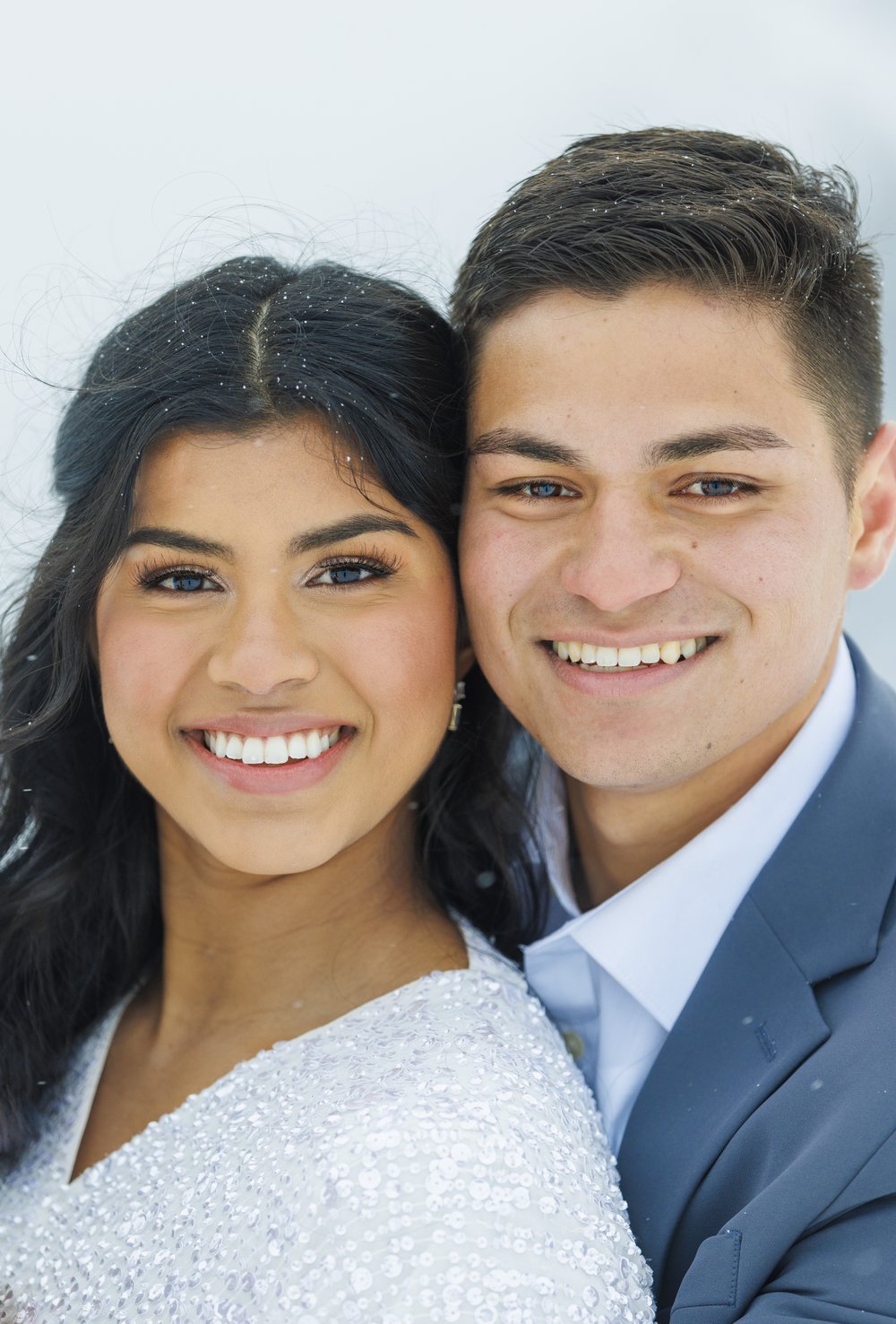  Savanna Richardson Photography captures a portrait of the bride and groom's faces side by side. wedding portrait #SavannaRichardsonPhotography #SavannaRichardsonBridals #WinterBridals #WinterWedding #TibbleForkBridals #UtahBridals #MountainBridals 