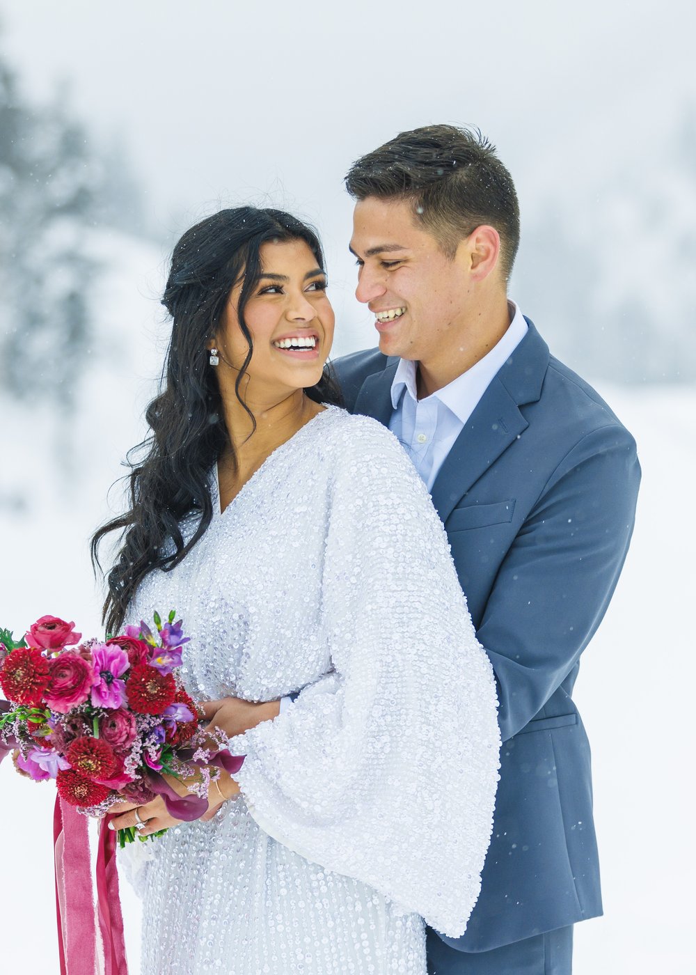  At Tibble Fork Canyon a groom wraps his arms around his fiance by Savanna Richardson Photography. professional #SavannaRichardsonPhotography #SavannaRichardsonBridals #WinterBridals #WinterWedding #TibbleForkBridals #UtahBridals #MountainBridals 