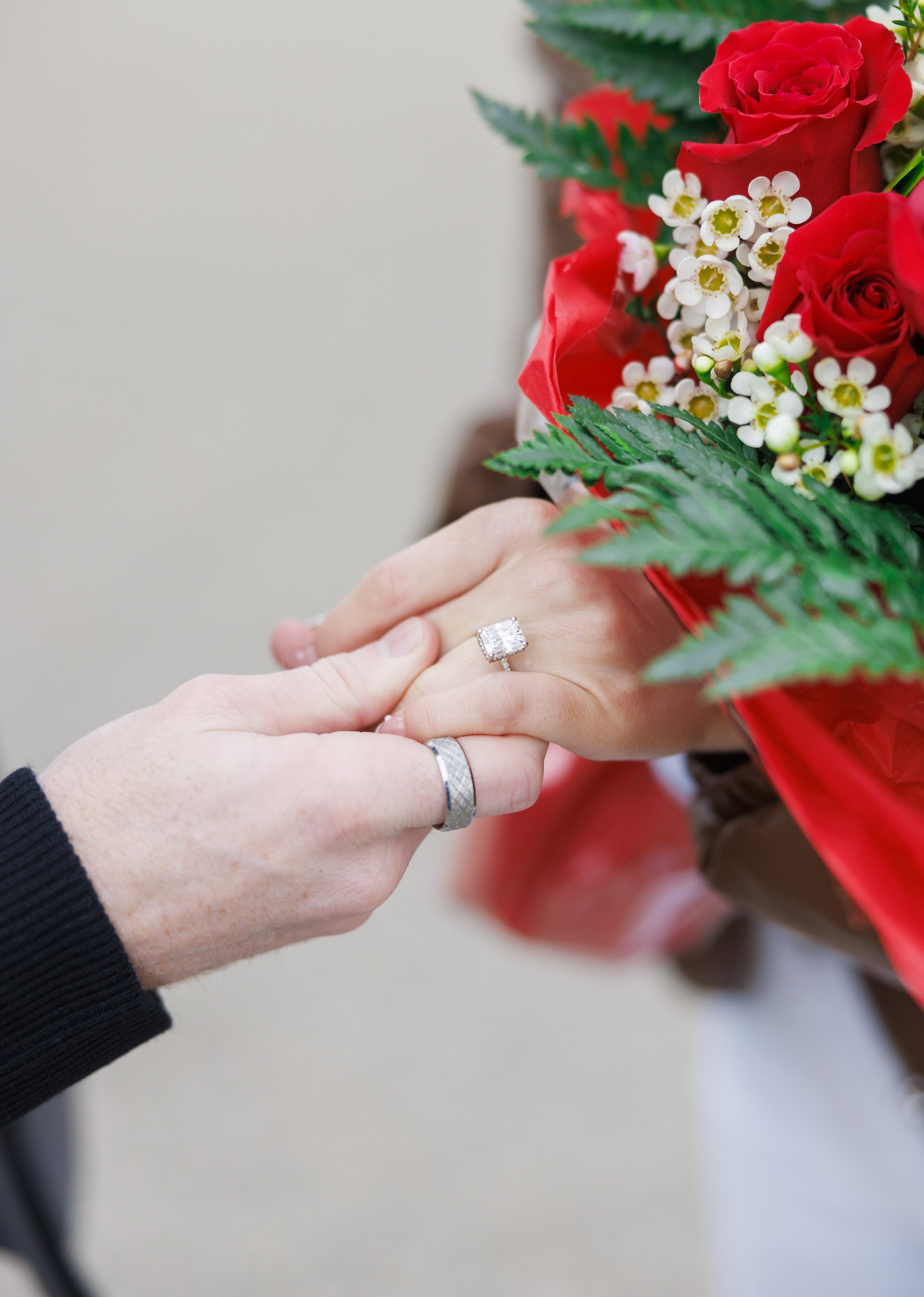  A close-up of the engagement ring being put on a woman's finger during a proposal by Savanna Richardson Photography. wedding ring ideas red rose bouquets for proposal #SavannaRichardsonPhotography #SavannaRichardsonEngagements #utahproposals #helico