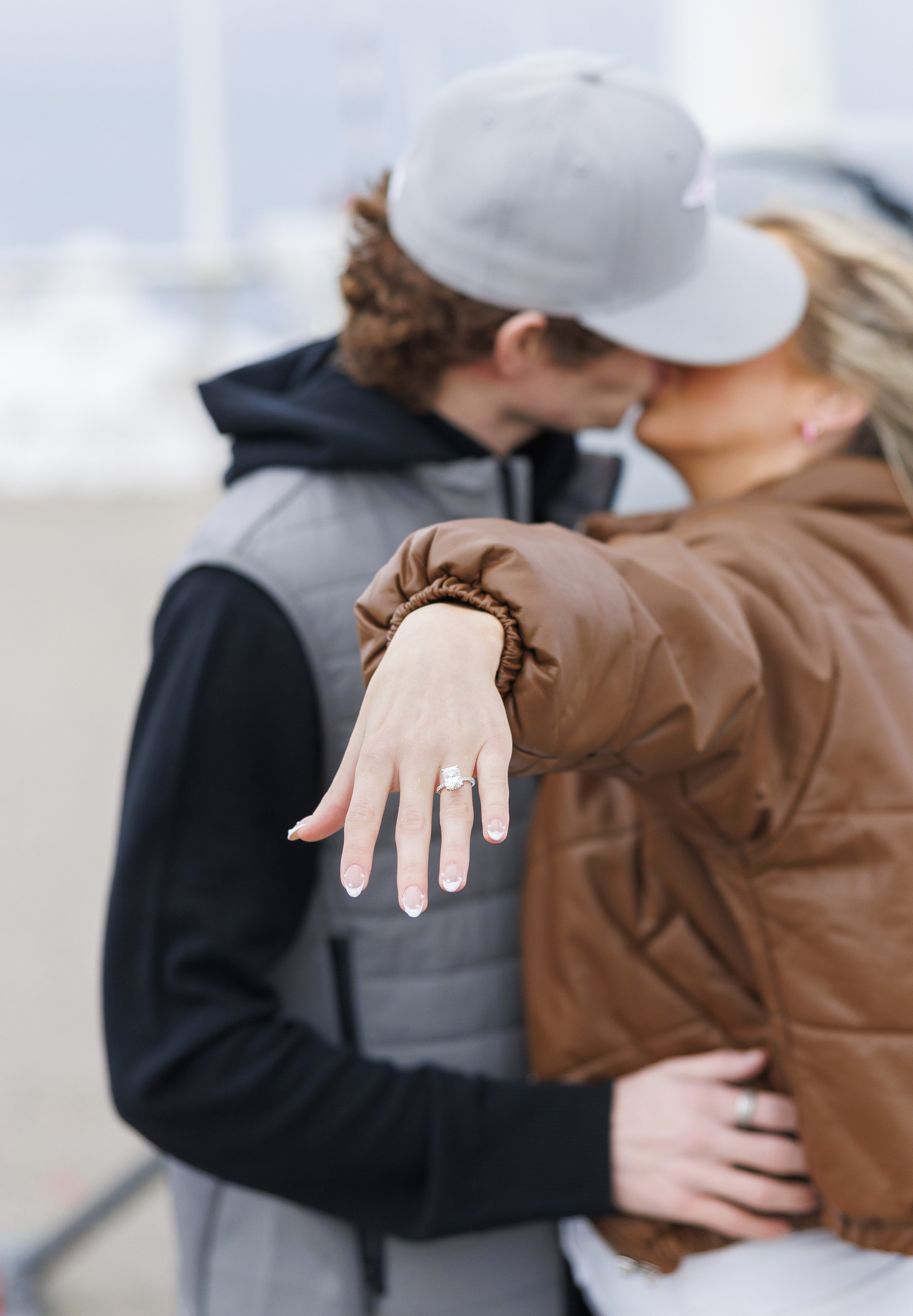  Boyfriend and girlfriend kiss after the proposal with the woman showing off the ring by Savanna Richardson Photography. spring proposals ring proposal portrait #SavannaRichardsonPhotography #SavannaRichardsonEngagements #utahproposals #helicopterpro