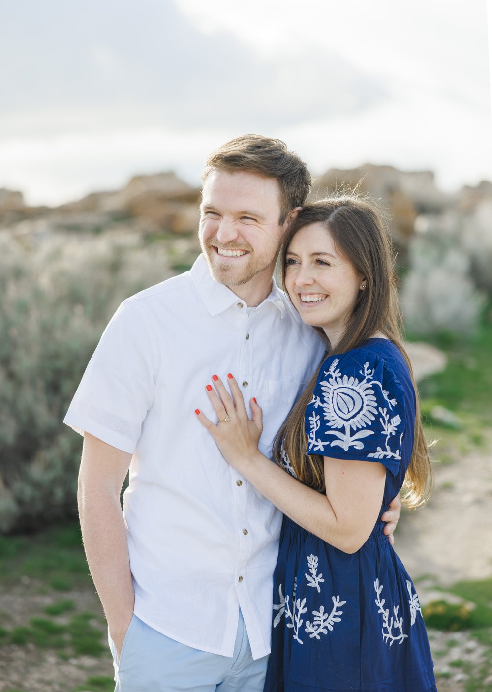  Savanna Richardson Photography captures a portrait of a soon-to-be husband and wife smiling in spring attire. spring engagement outfits blue dress blue shorts simple #SavannaRichardsonPhotography #SavannaRichardsonEngagements #UtahEngagements #Antel