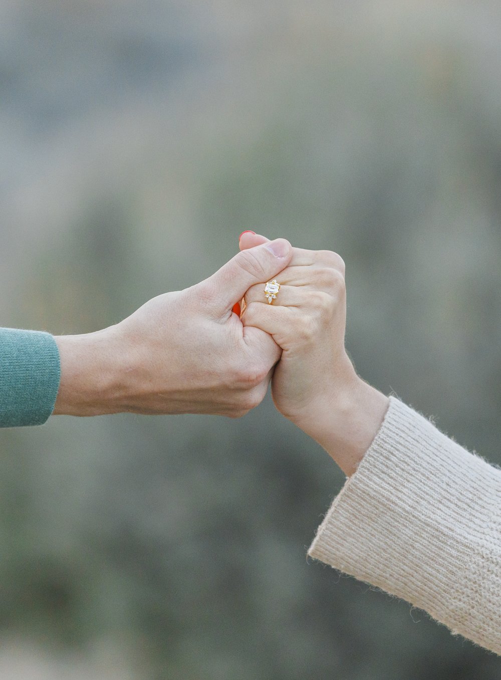  Close-up of a man holding a woman's hand with a gold and diamond wedding ring on her finger by Savanna Richardson Photography. gold wedding ring ring portraits #SavannaRichardsonPhotography #SavannaRichardsonEngagements #UtahEngagements #AntelopeIsl