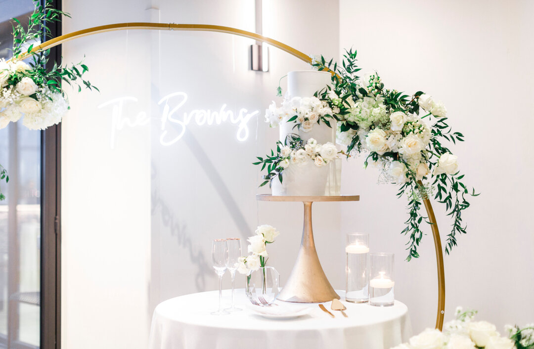 Cake, champagne, and flowers. A beautiful statement for any wedding!