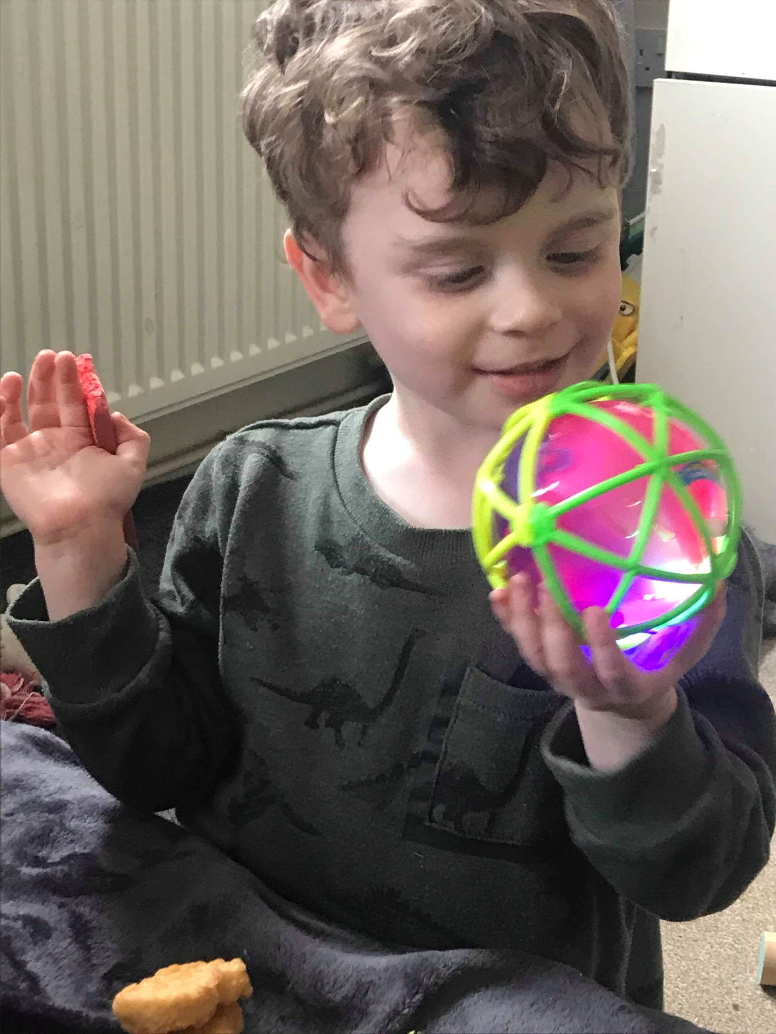 child with sensory ball July 2021.jpeg