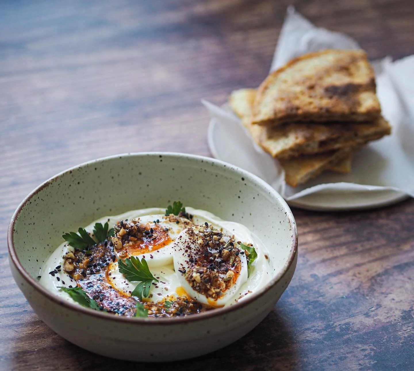 Turkish eggs with chilli butter, smoked almond dukkah and sourdough discard crumpet flatbread. Sort of a cheat version but who cares as long as it&rsquo;s good hey?

Deets for one 
1-2 eggs, boiled for 5 1/2 minutes, cooled and peeled. 
Melt a knob o
