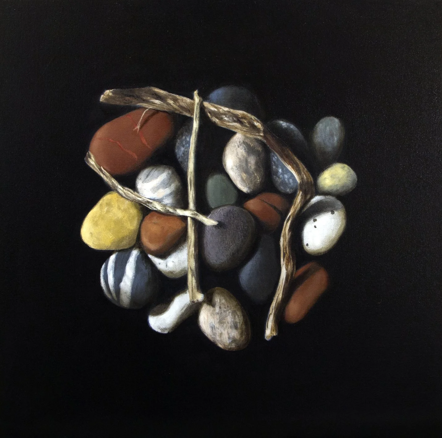 Still life in oils of driftwood on colourful pebbles against a dark background by Mike Skidmore.