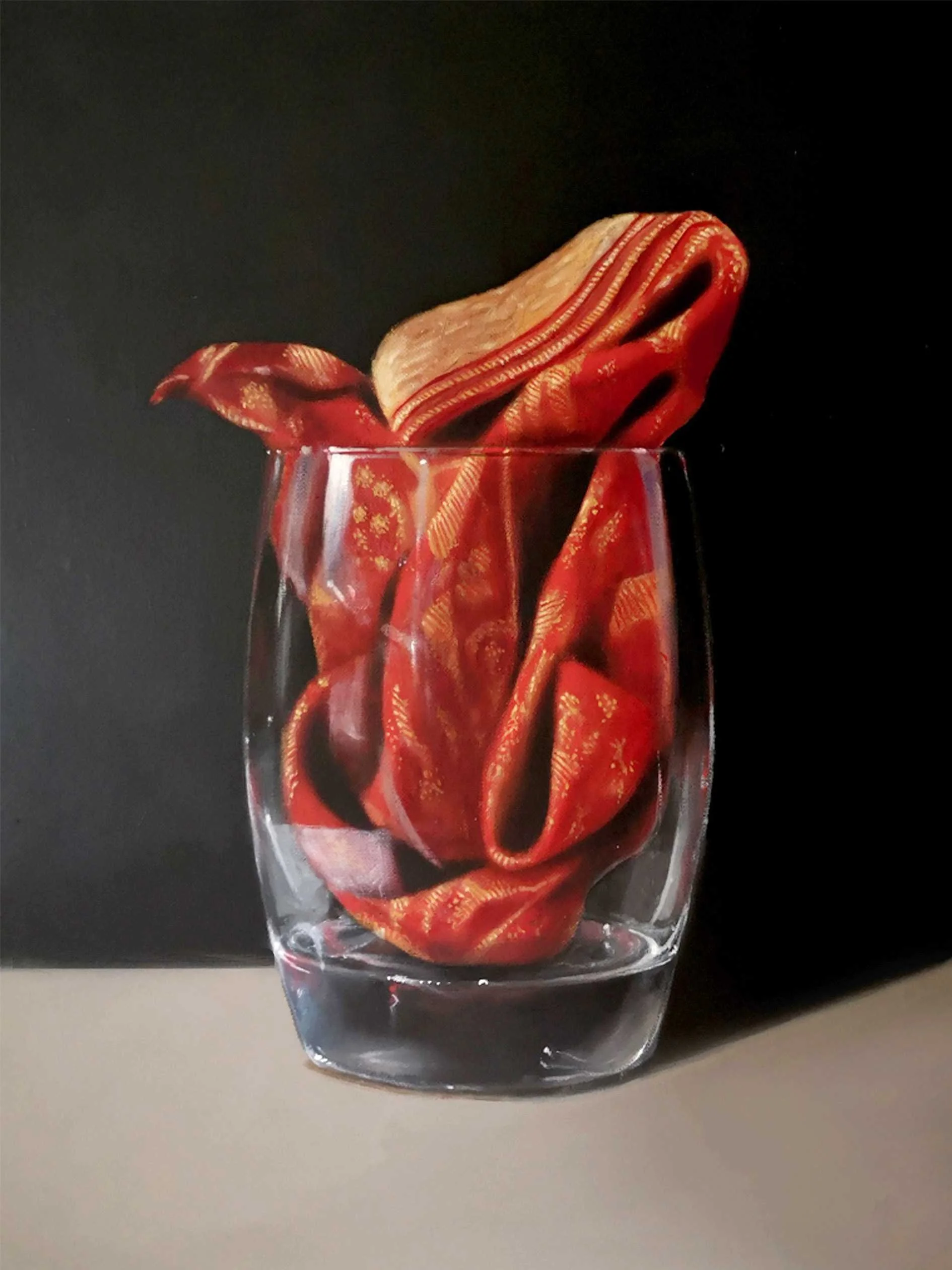 Still life oil painting of red cloth in a glass.