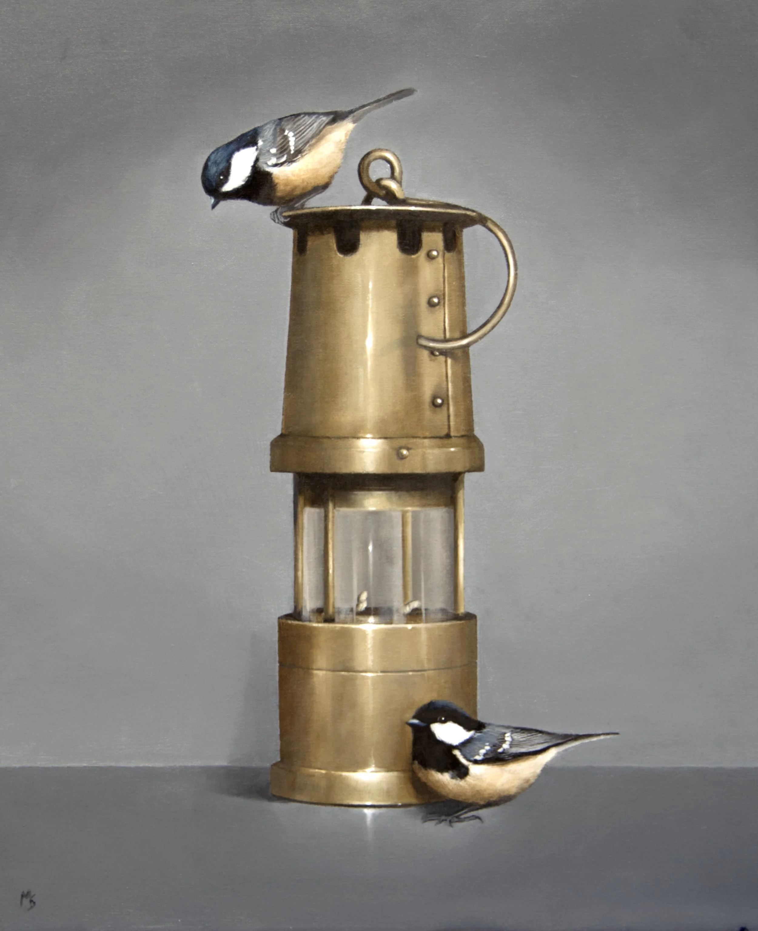 Still life of a Davey. lamp with coal tit birds.