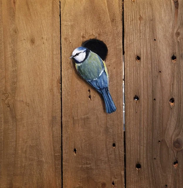Oil painting of a blue tit perching on real reclaimed wood.