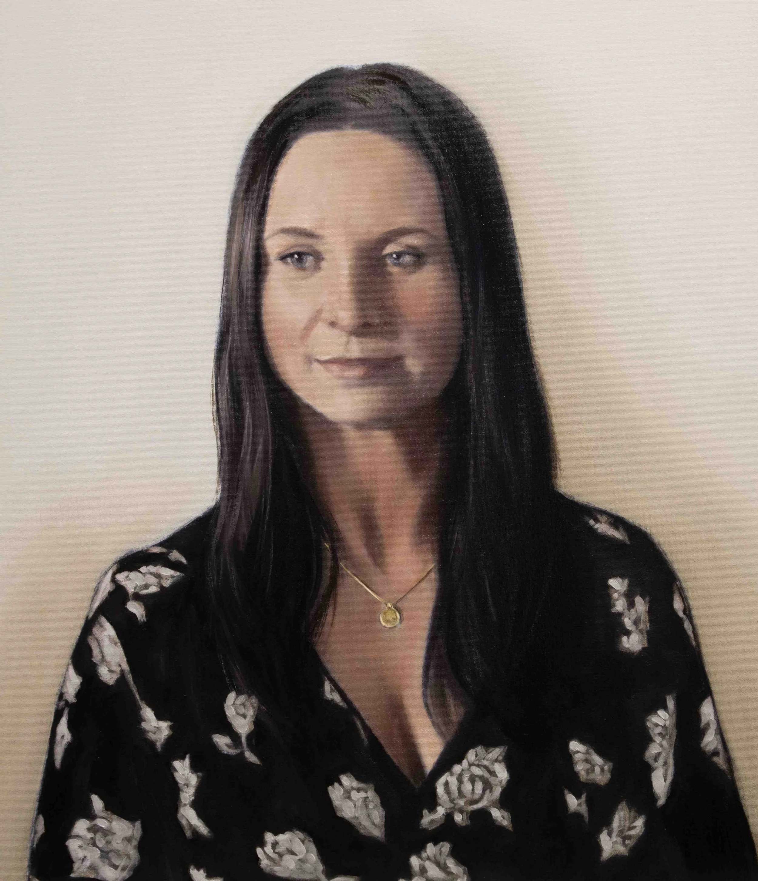 Portrait painting in oils of a young woman.