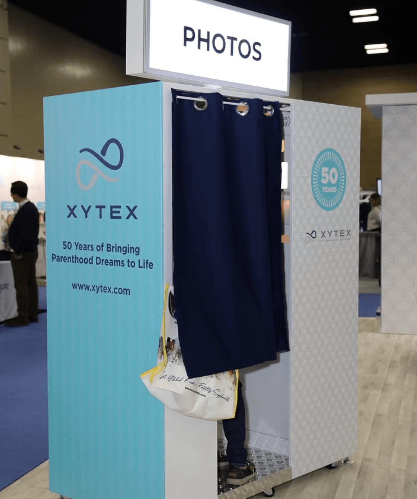Fully branded enclosed corporate photo booth rental with custom booth wrap and experiential marketing design for XYTEX event activation in Texas