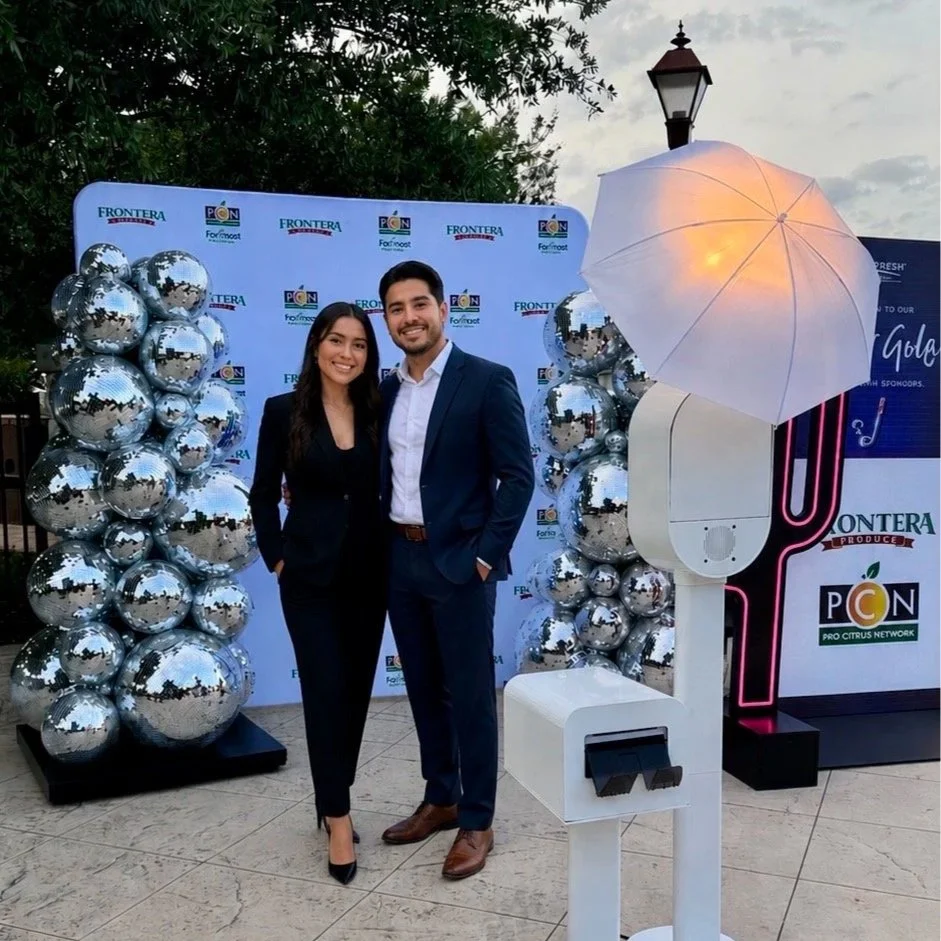 Custom branded step-and-repeat backdrop with a photo booth experience by [MBP Photo Booth](https://mbpphotoboothco.com?utm_source=chatgpt.com) at a mixer event during the 2025 Viva Fresh Expo in San Antonio.