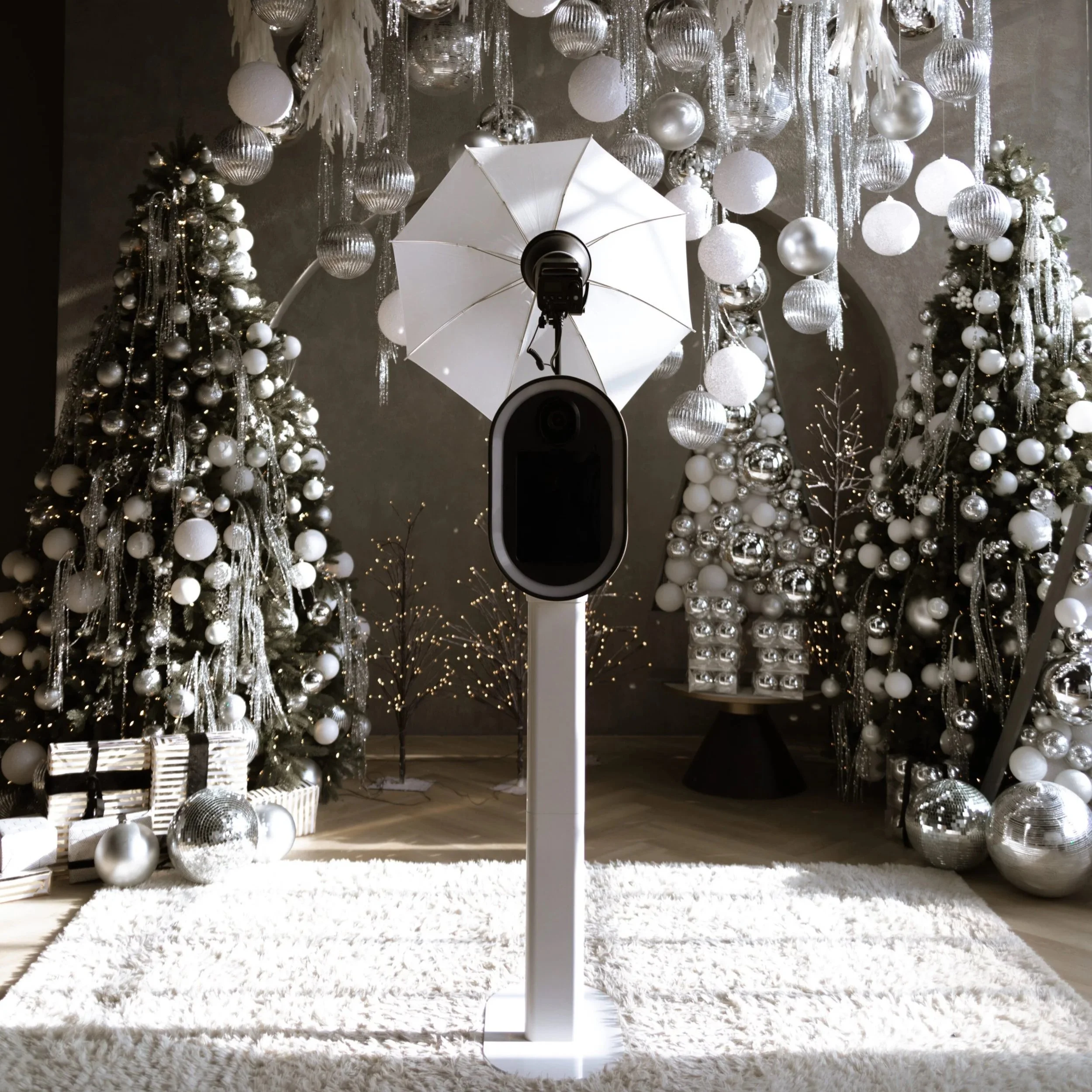 Modern open-air photo booth setup with studio lighting and luxury holiday event backdrop for upscale corporate celebration in Texas