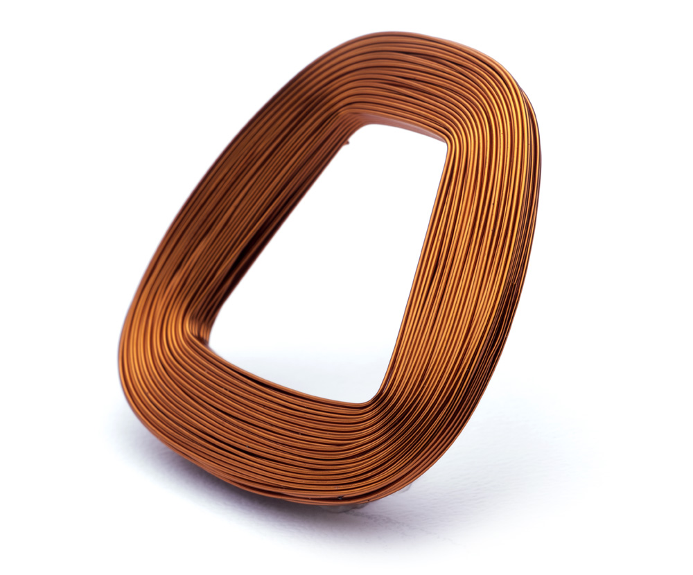 Electromagnetic coil used for wind generators and wind turbines (rectangular-shaped coil of copper wire on white background).