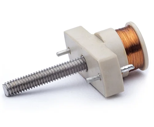 Small coriolis coil component with metal screw, white plastic part, and copper wire coil shown on white background