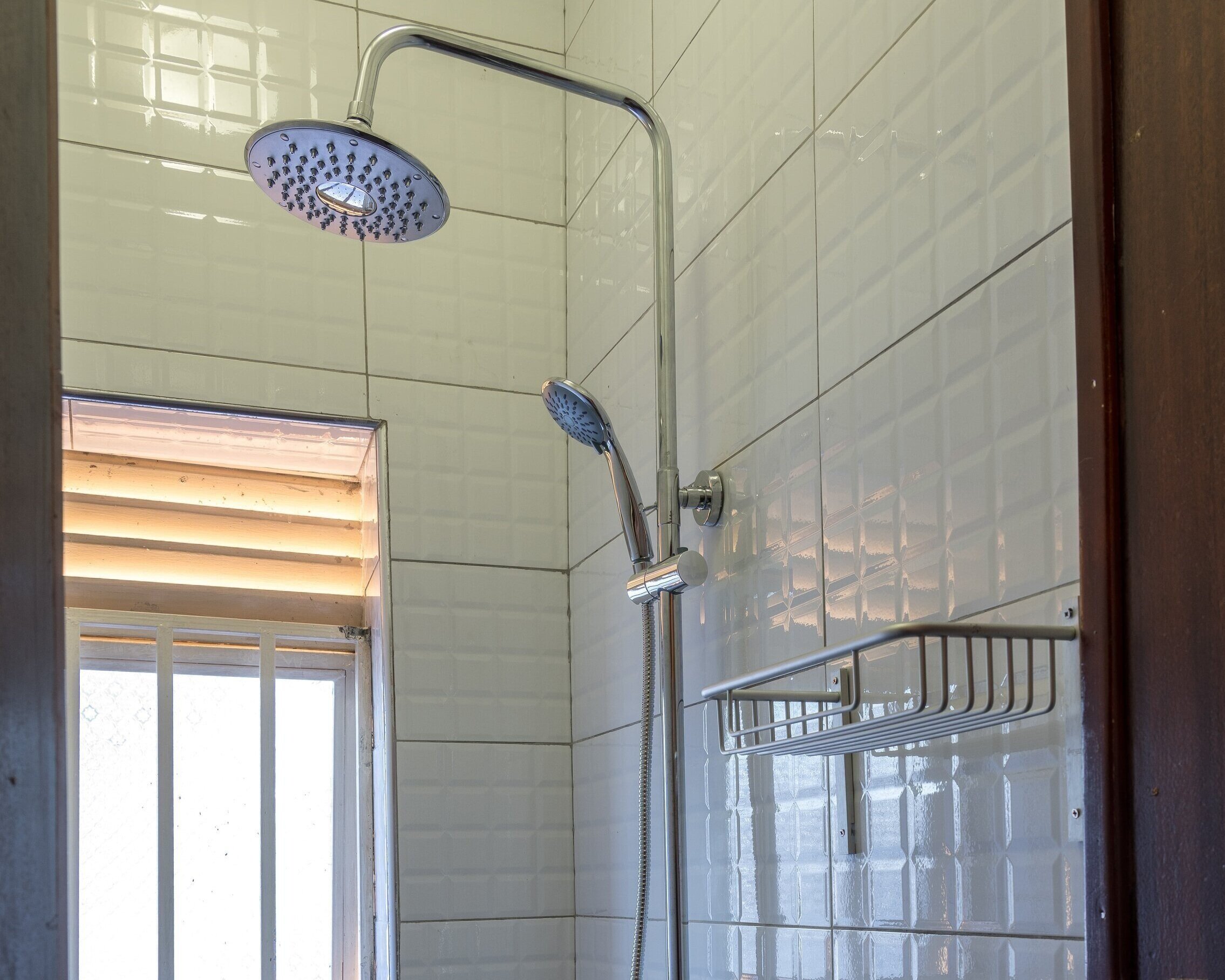 Waterfall shower bathroom in guesthouse accommodation