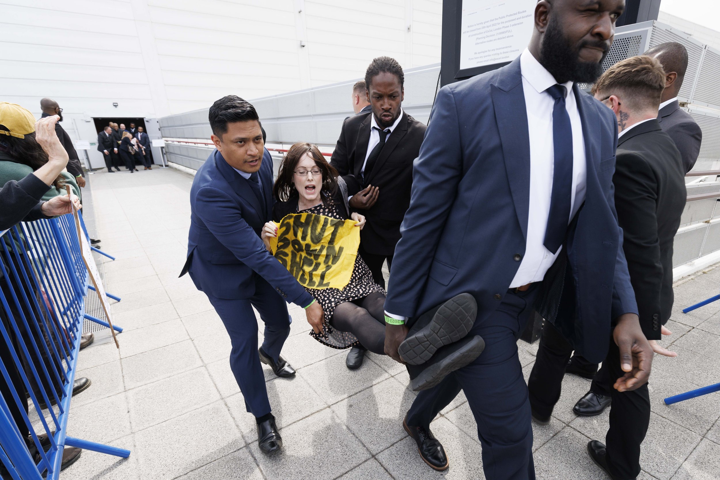  A climat change protestor is removed from Shell’s AGM by security at The Excel - May 2023.  