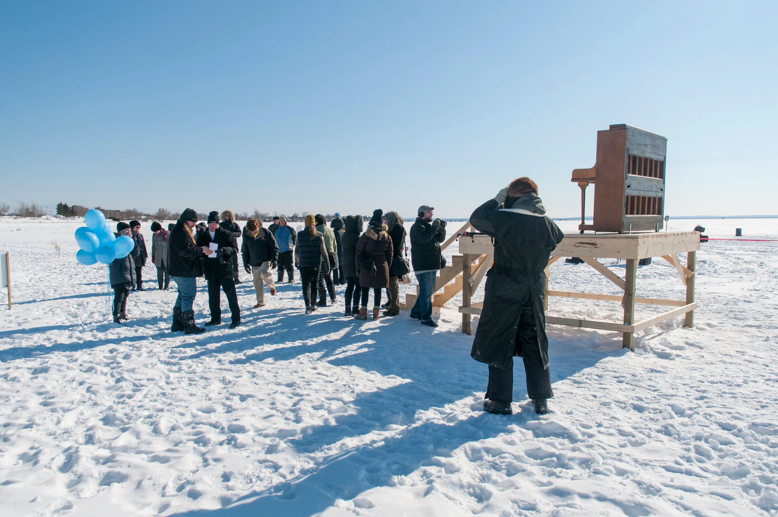 Local politicians making an important cultural funding announcement at a 2014 Ice Follies installation, "A Piano Listening to Itself - Chopin Chord with Cowell Variation" by Gordon Monahan. Photo by Liz Lott.