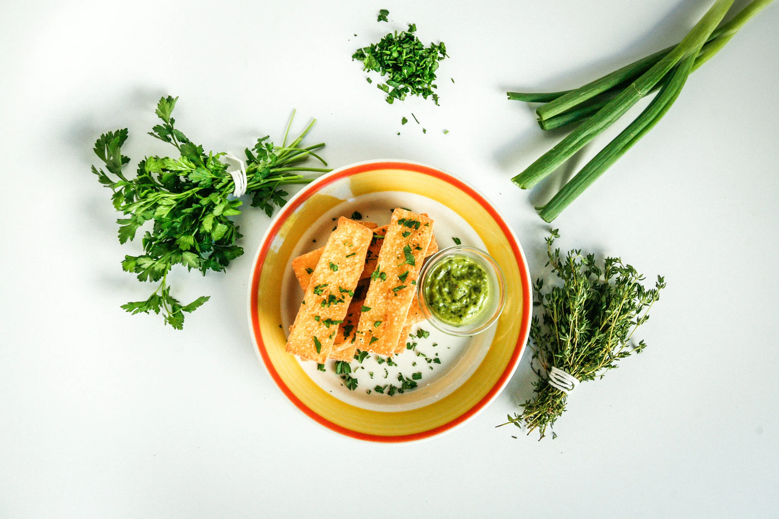 Polenta Fries  –   A locals favorite, this popular starter is cooked with Parmesan cheese &amp; fresh thyme, cut into strips, then fried until crispy. Served with Italian salsa verde dipping sauce